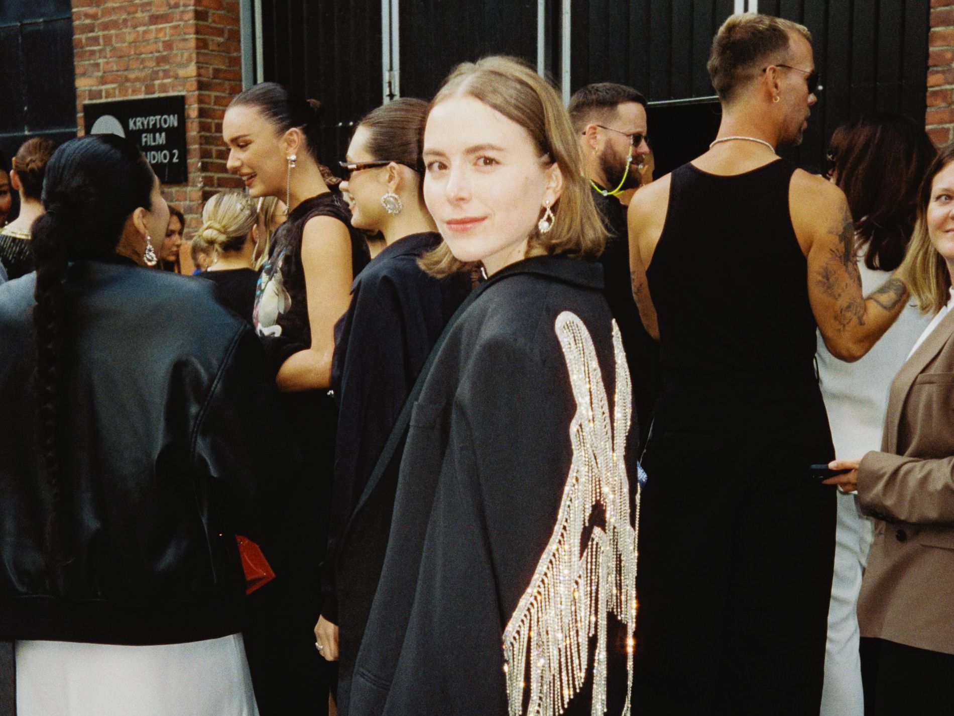 Senior Beauty & Shopping Editor Josefin Forsberg attends the Peral Octopuss.Y fashion show in Oslo during Oslo Runway wearing a pearl Octopussy beaded blazer and jeans. 