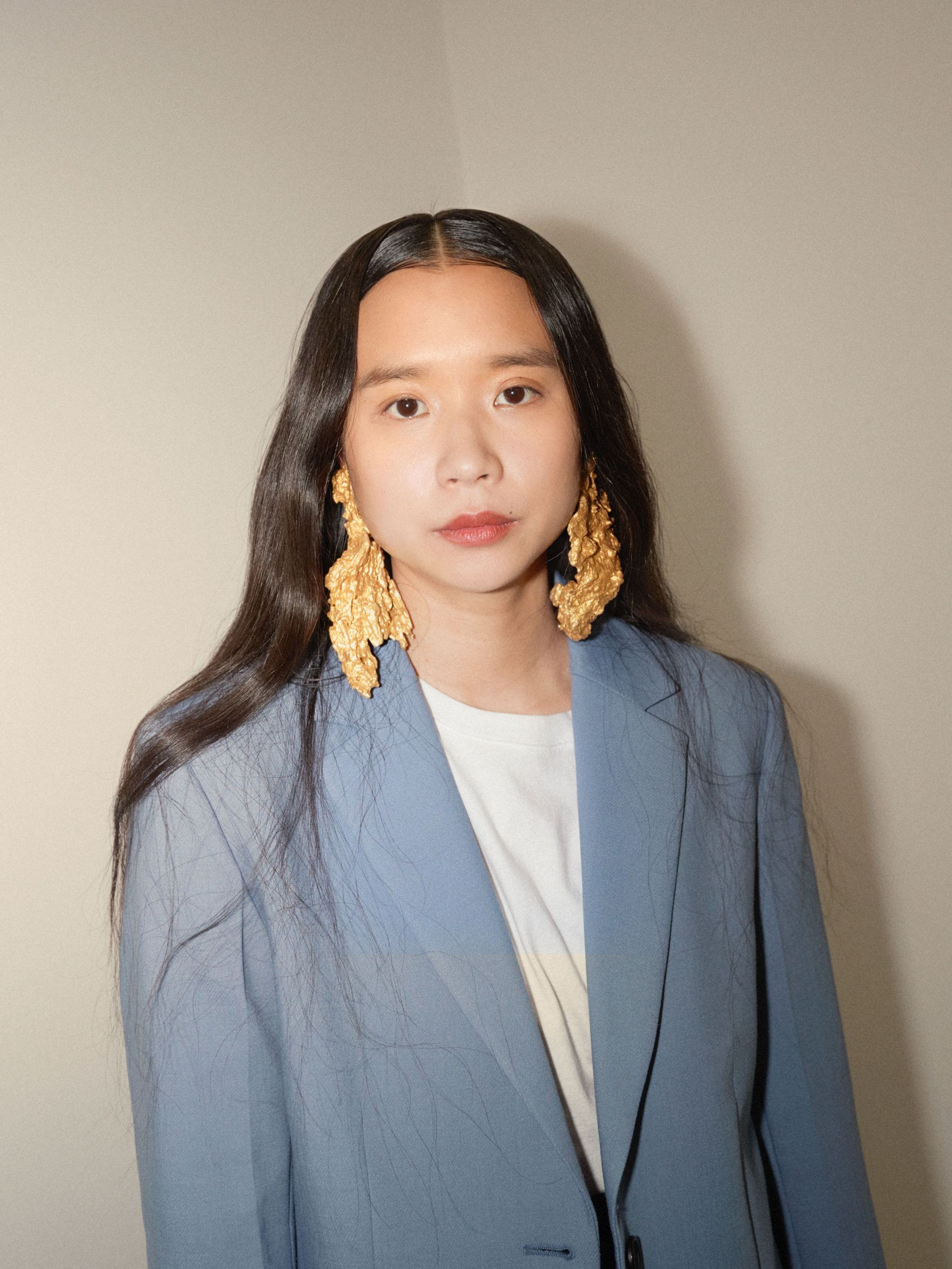 Lap-See Lam wearing Ingy earrings