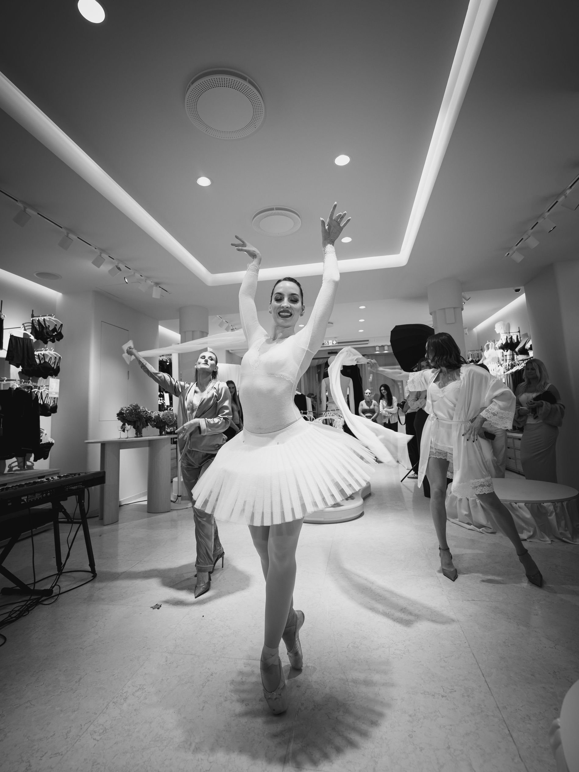 A ballerina performing at the Intimissimi X Vogue Scandinavia event in white tulle skirt and tight white body