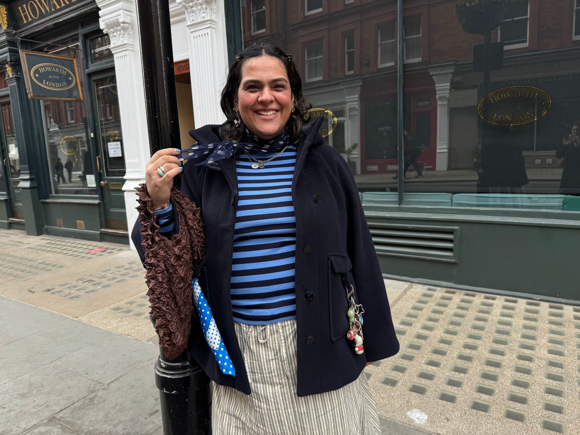 A woman standing on the streets of London