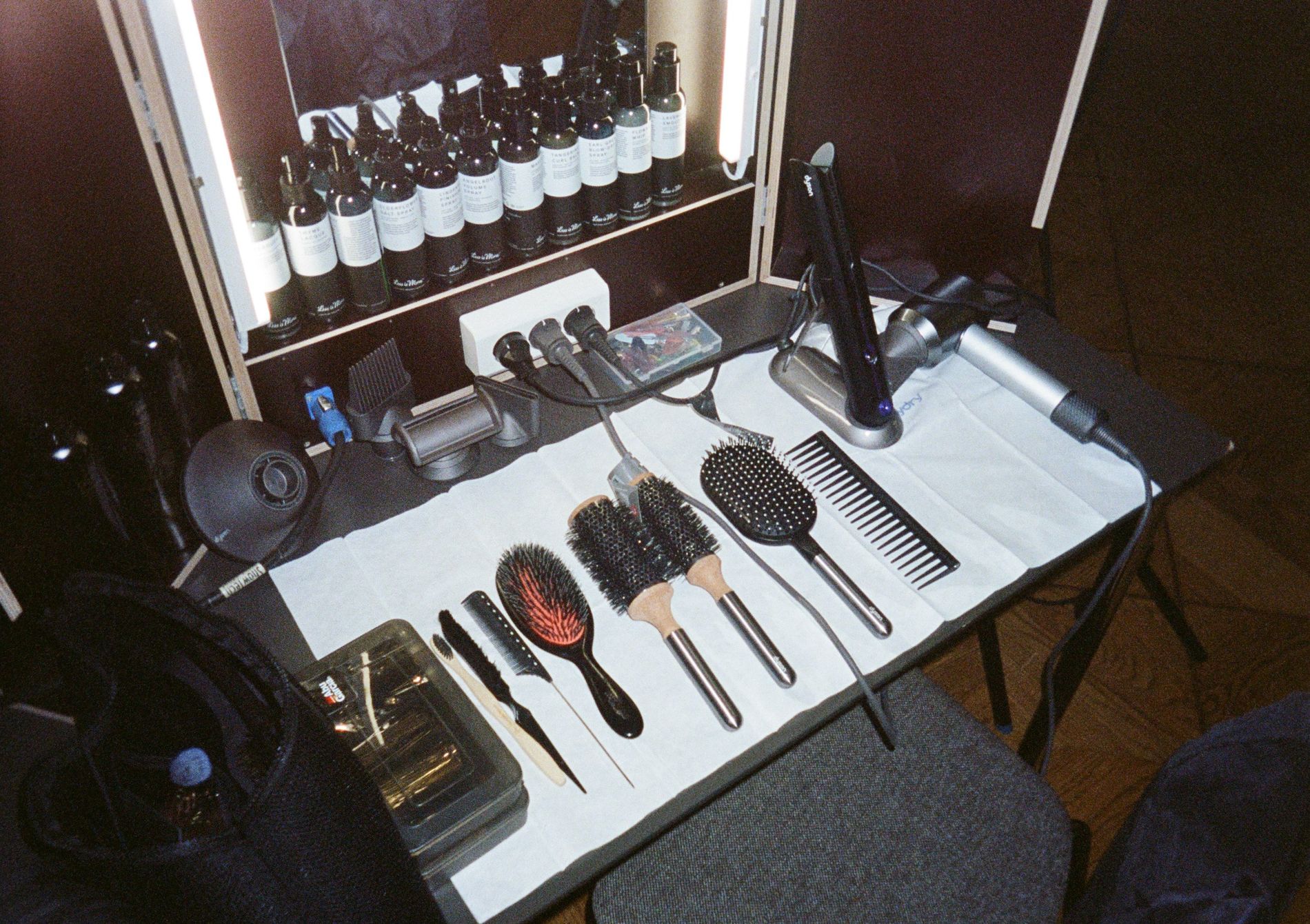 Hair tools are displayed backstage at the Garment's AW24 Copenhagen Fashion Week show