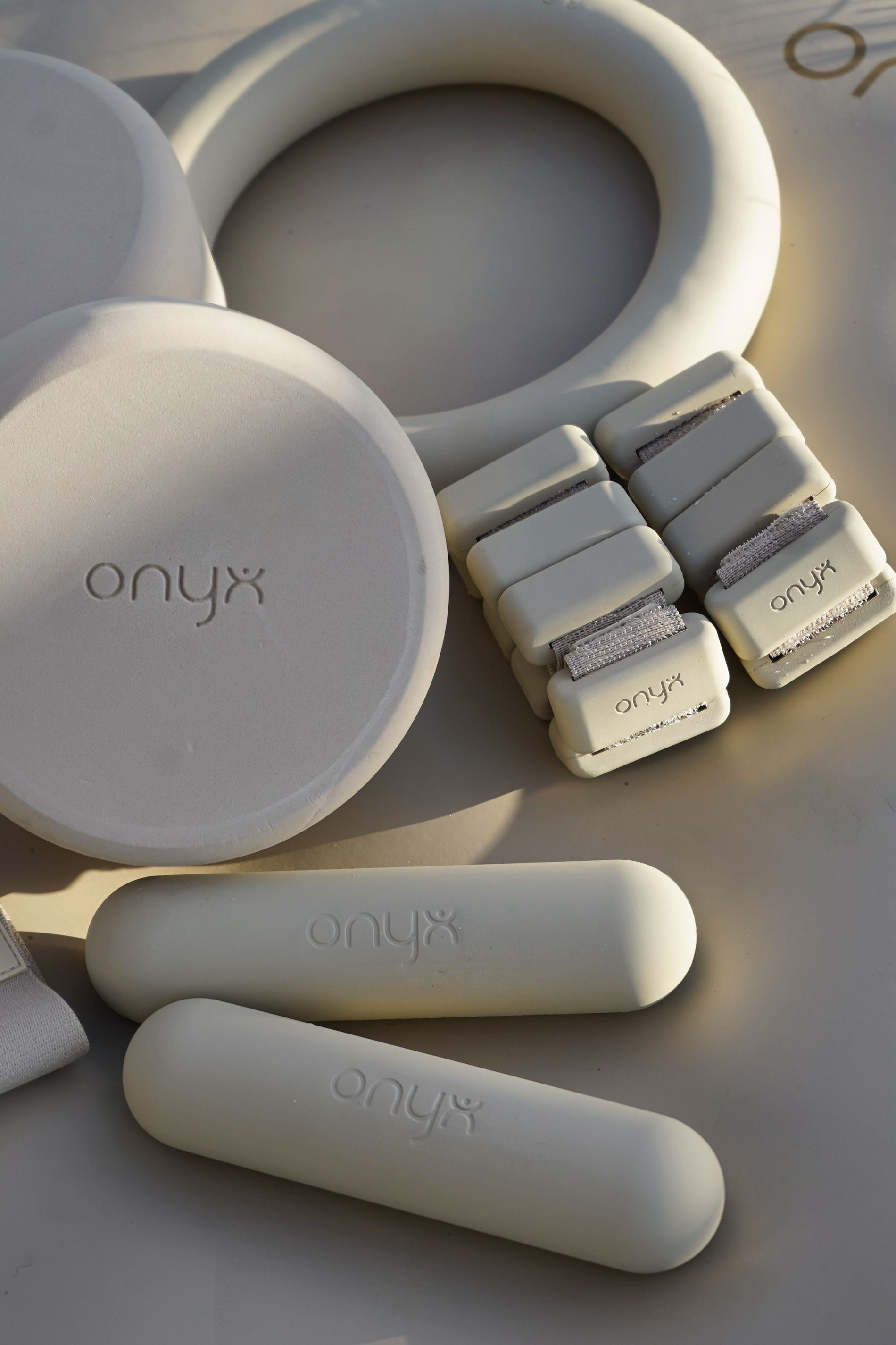 onyx workout kit in cream with handweights, ankel weights, yoga block and weighted ring