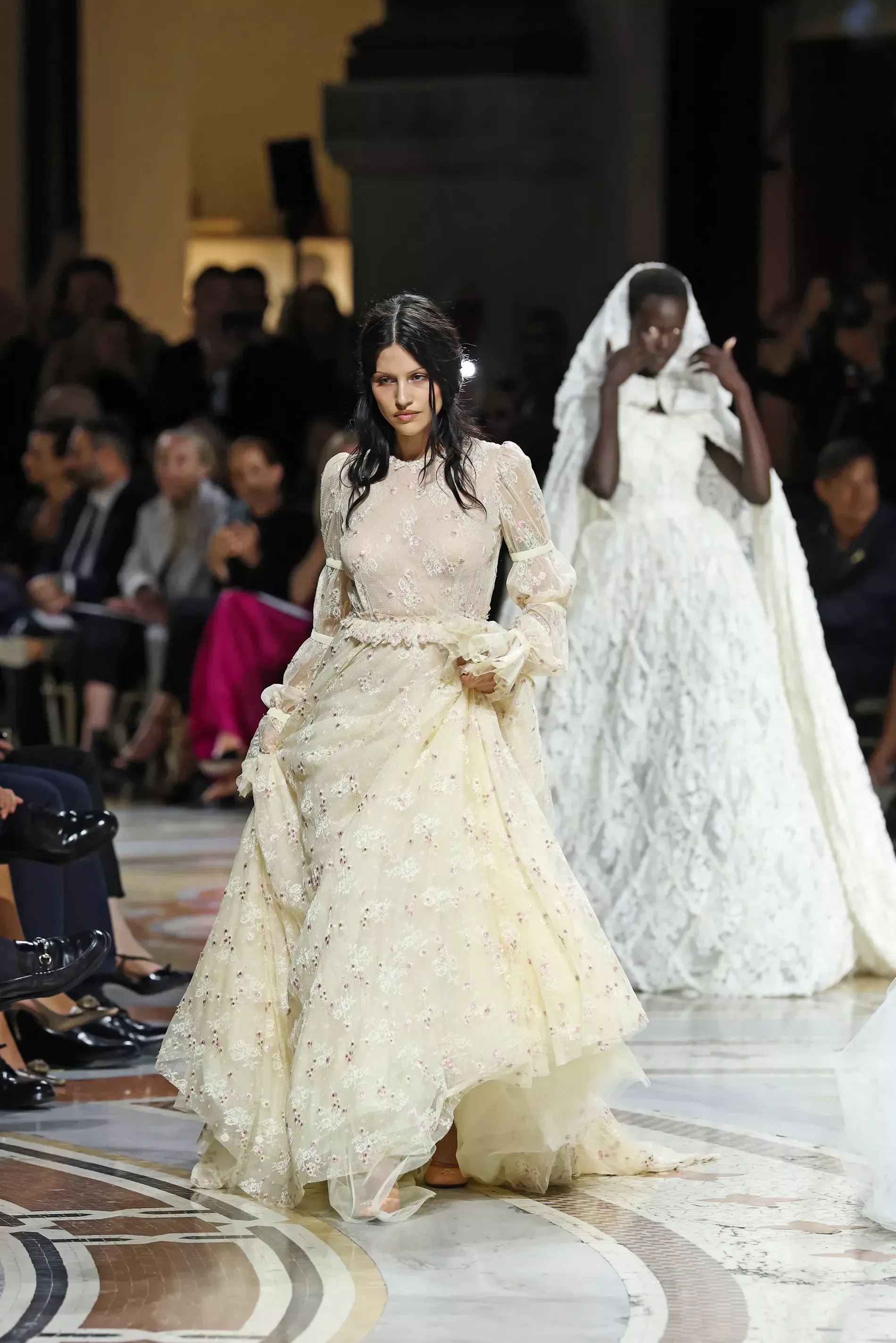 Gabbriette in a cream white tulle dress, in Milan fashion week 2026