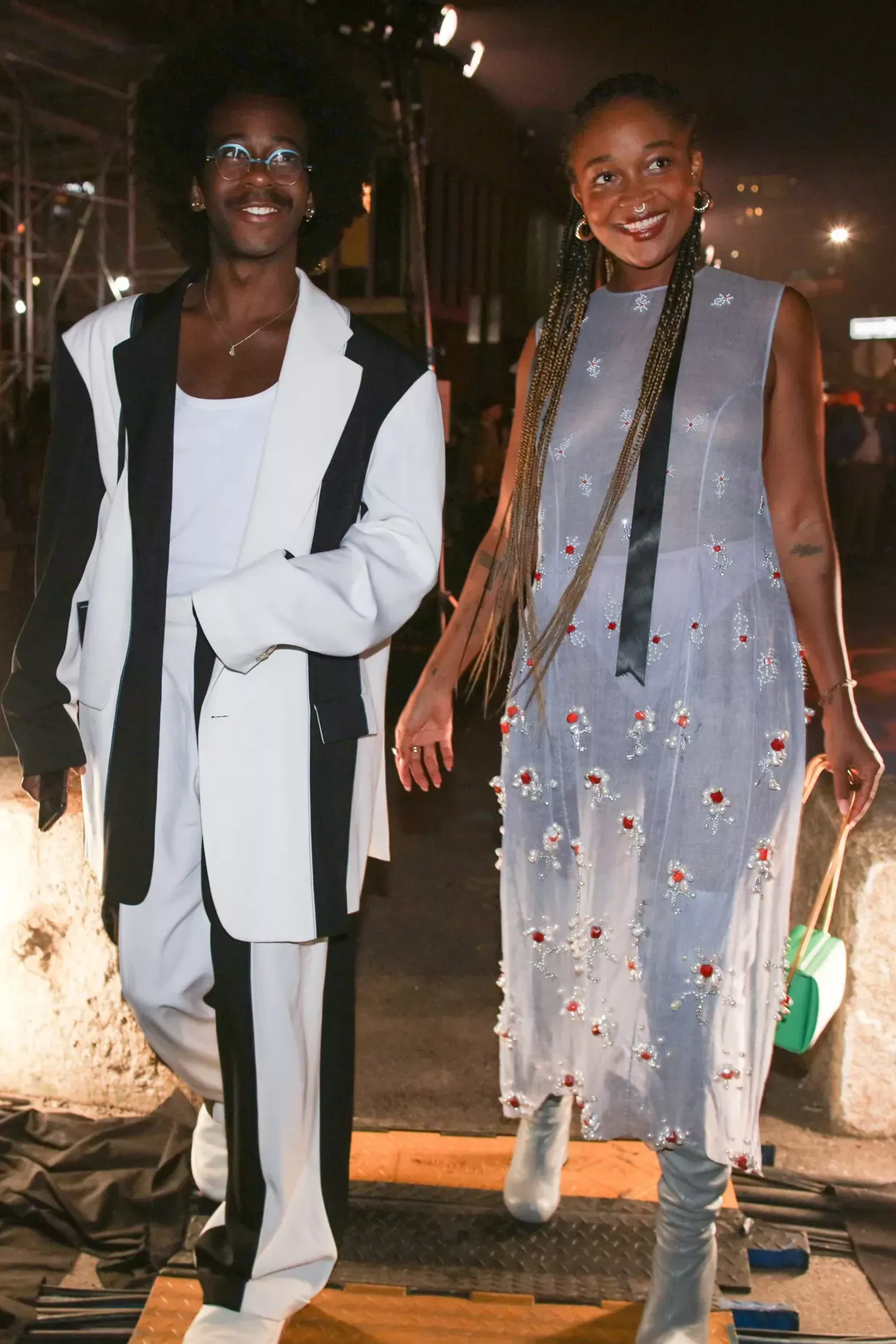 New york fashion week guests wear black and white suit and etheral midsummer style dress