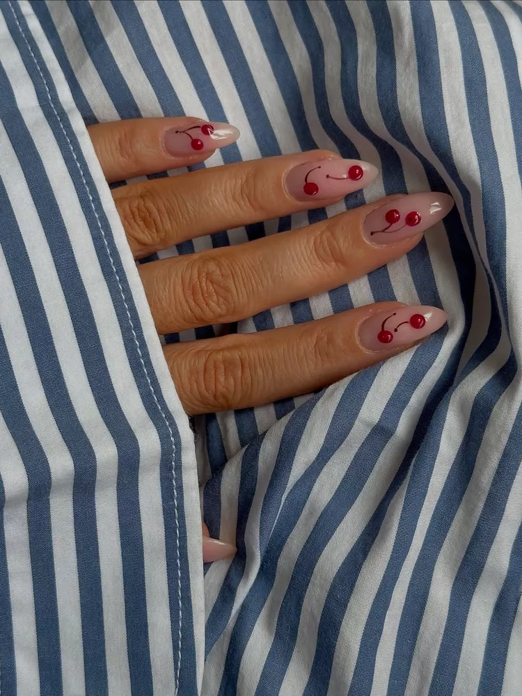 One of the most popular nail trends for 2025 is the cherry motif, seen here on Carin Falk