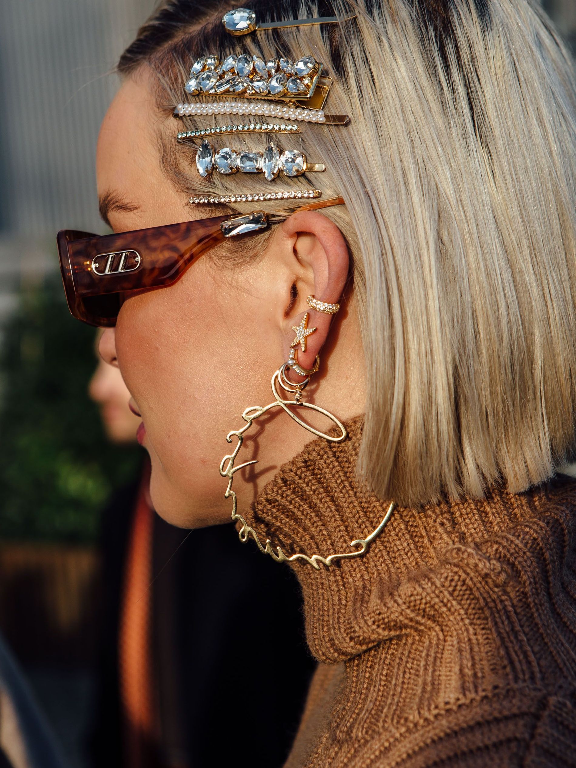 A guest wears bedazzled hair clips when attending Copenhagen Fashion Week AW23