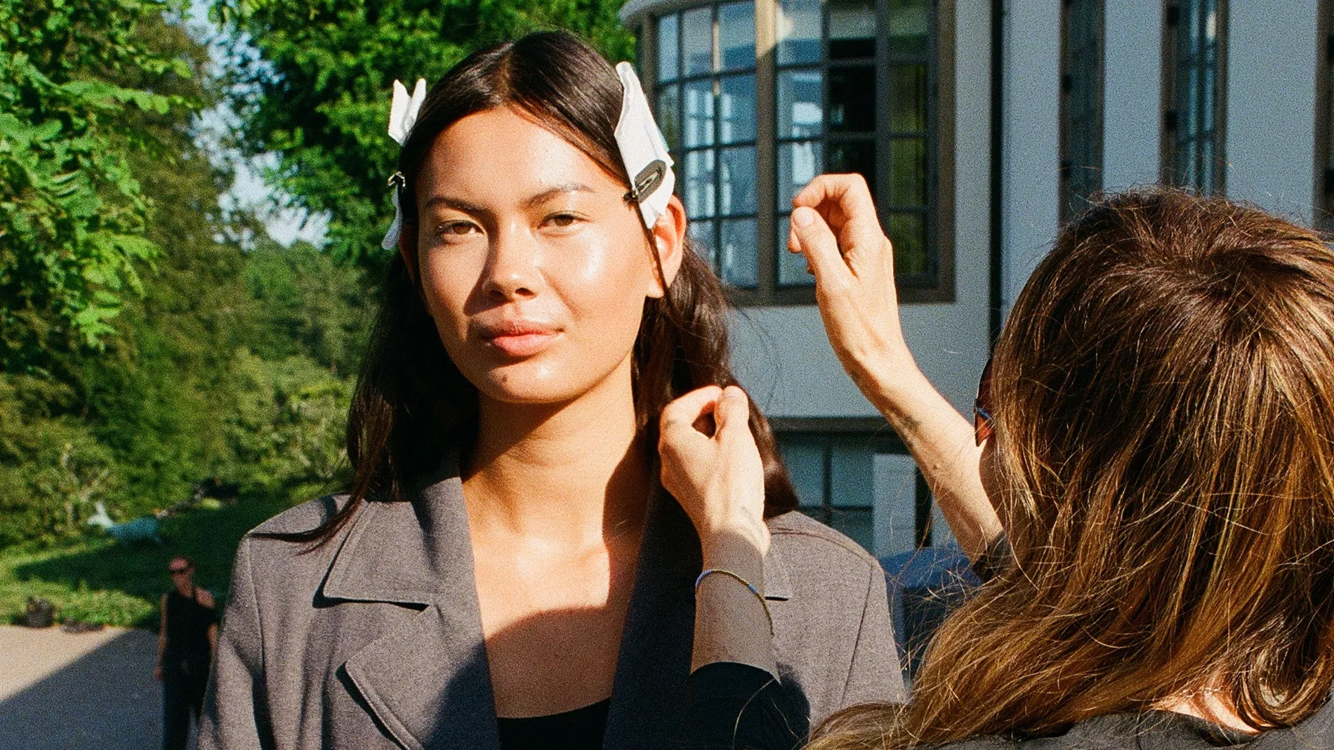Model getting her skin prepped at the By Malene Birger SS27 show