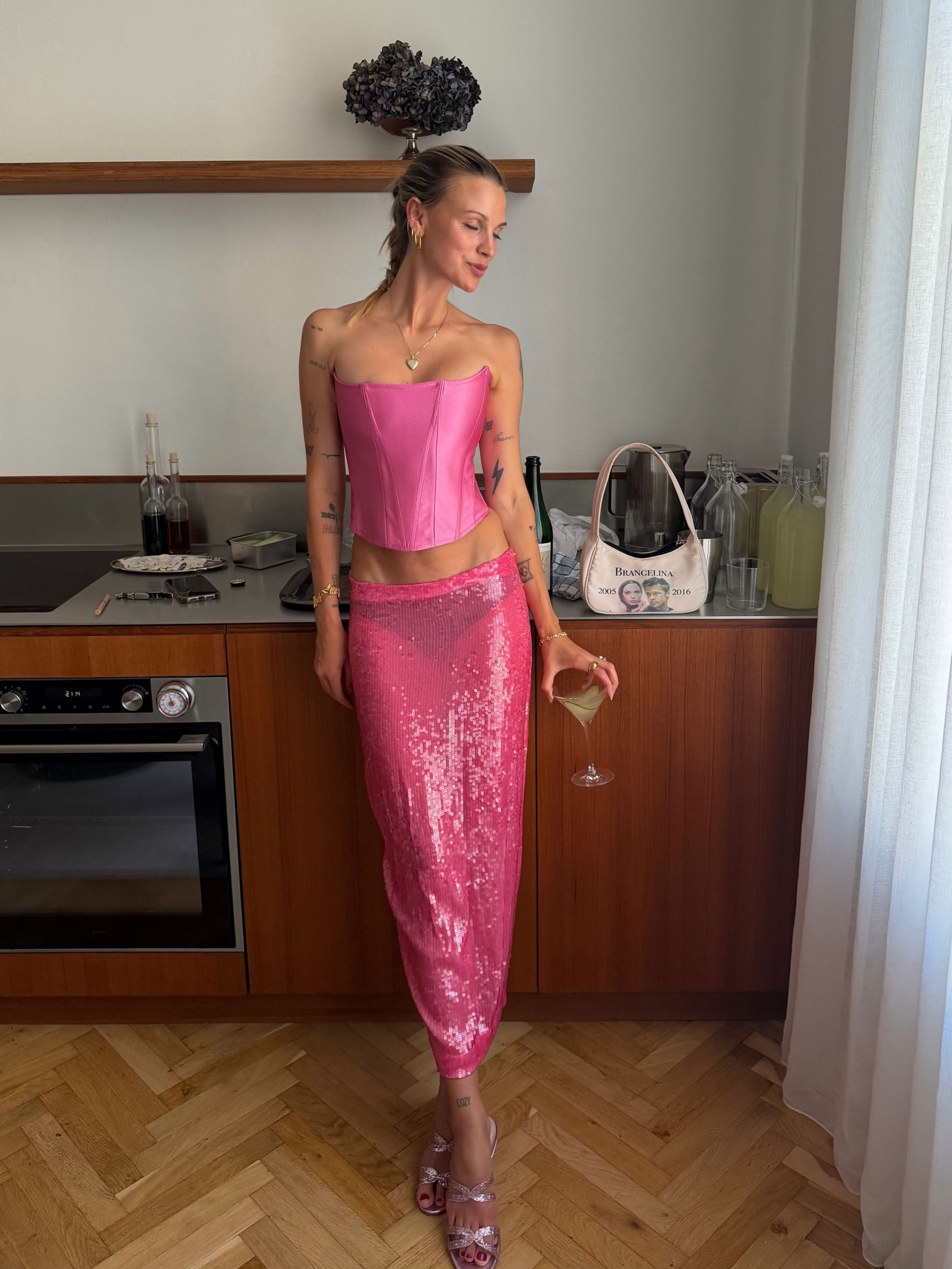 Anna winck wears a pink set from Rezek Studio and shoes from Sania Dmina to Copenhagen fashion week