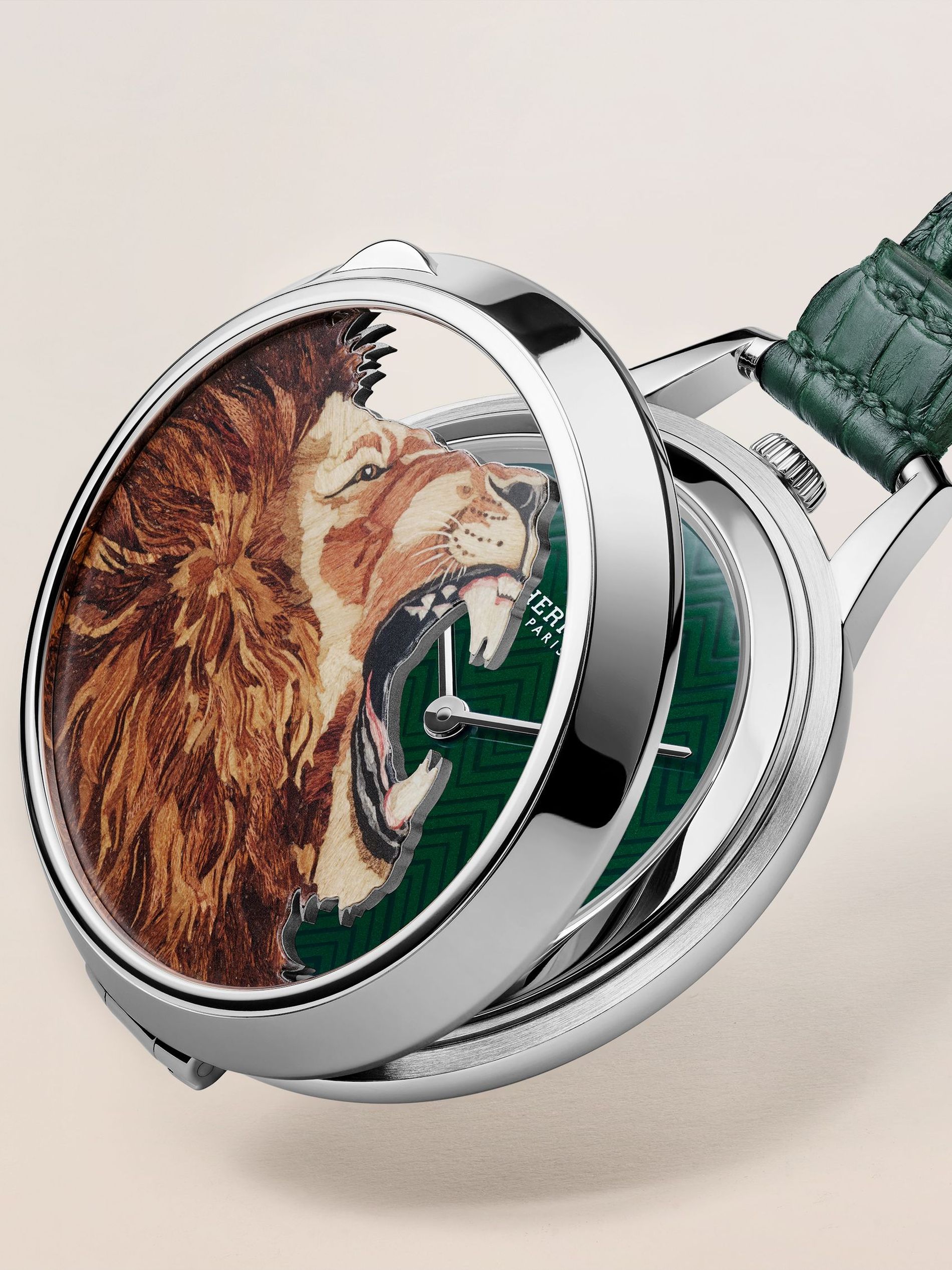 Hermès Roooar watch against a beige background