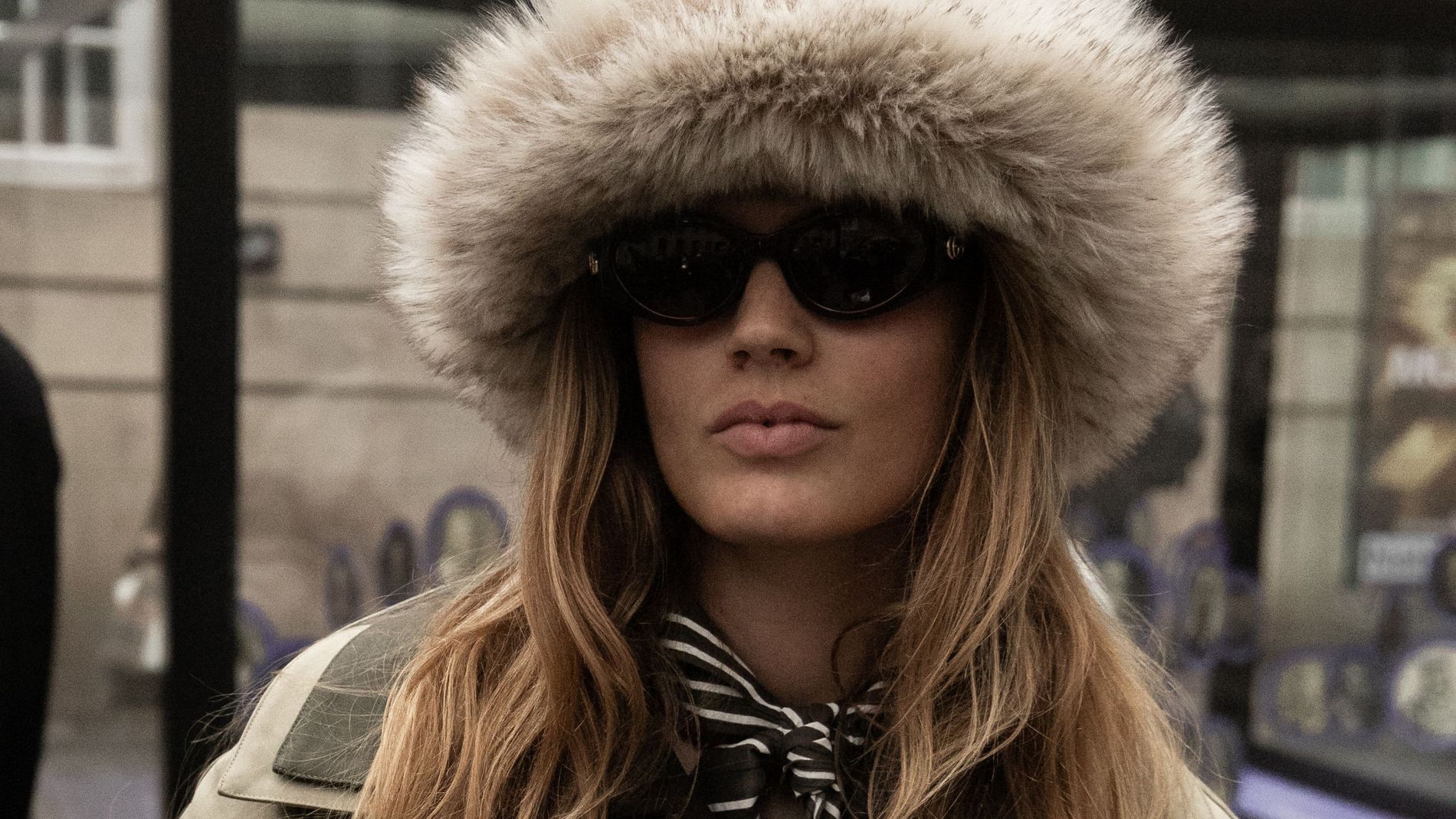 A guest wears a faux fur hat at Copenhagen Fashion Week