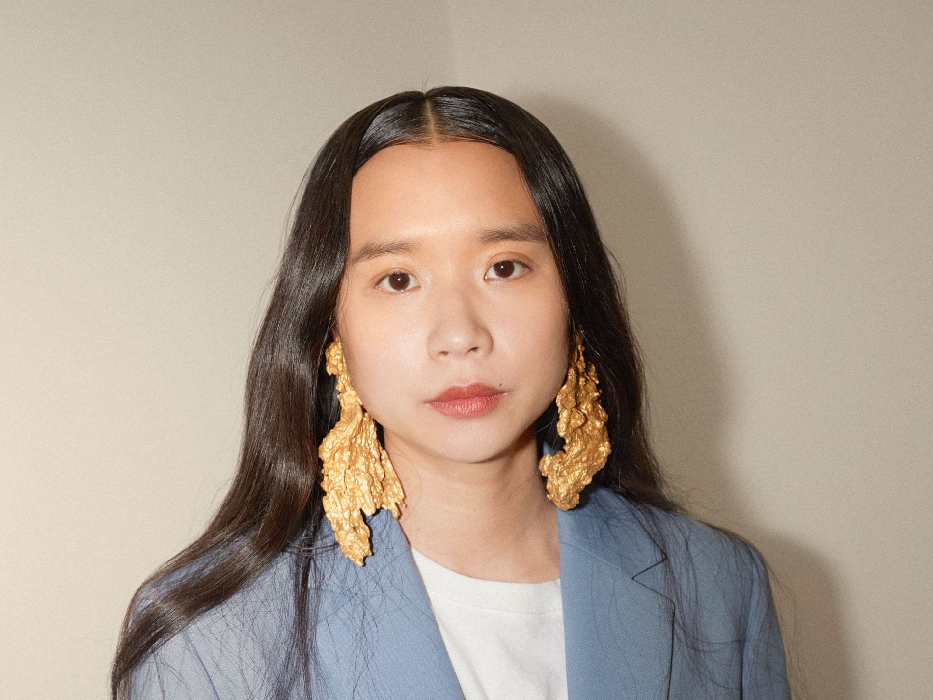 Lap-See Lam wearing Ingy earrings