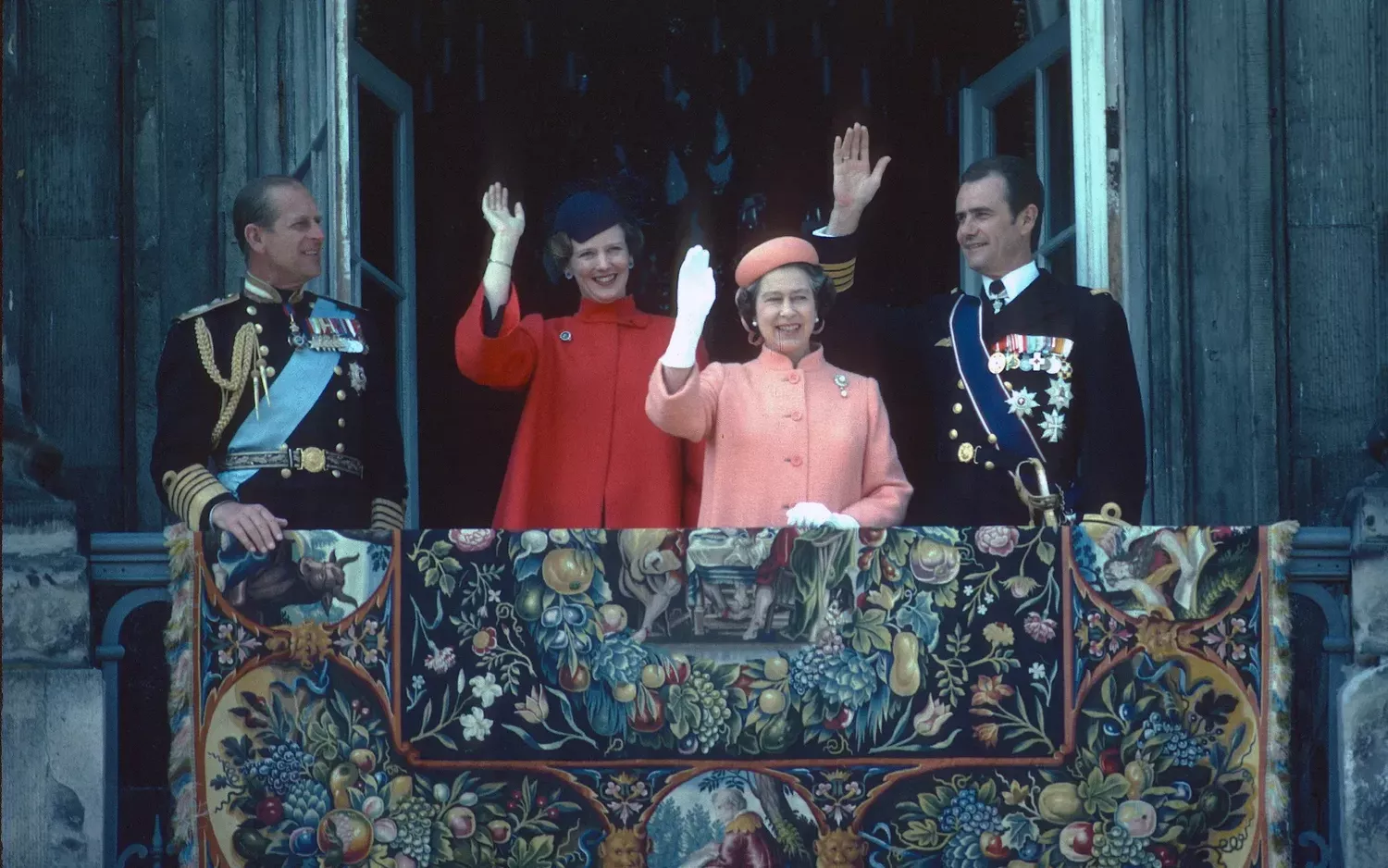 With Queen Elizabeth II of England and Prince Philip, Duke of Edinburgh, waving from the balcony in Copenhagen in May 1979.