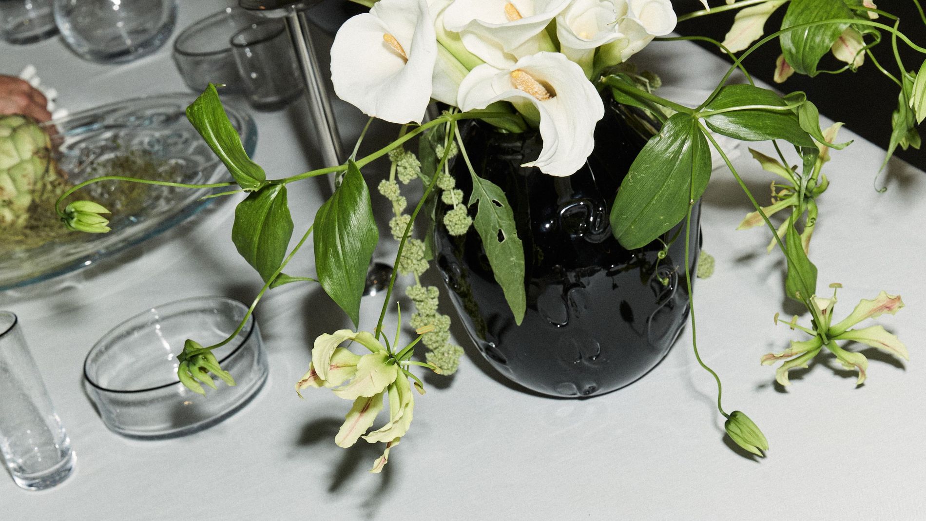 Table scape of Sophia Roe's interior collaboration, highlighting plates and glassware