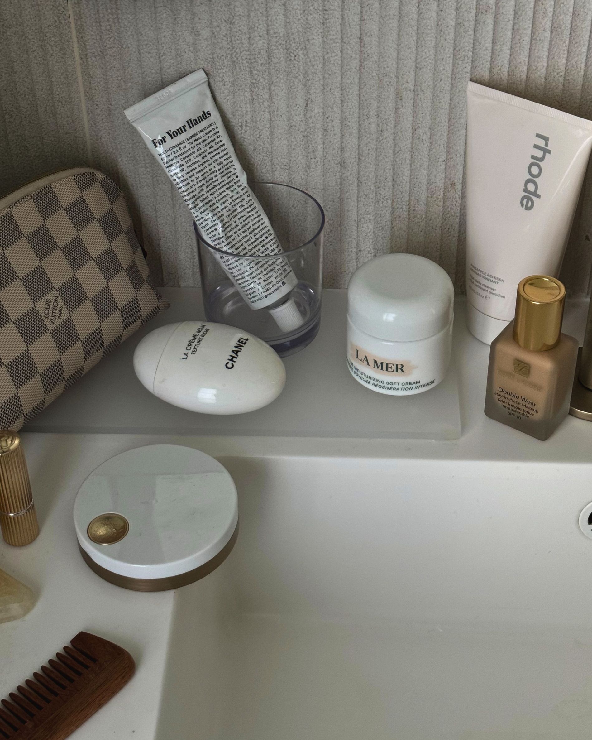 A close up of some of Tsutsumi Hoang's favourite beauty products displayed on her bathroom sink