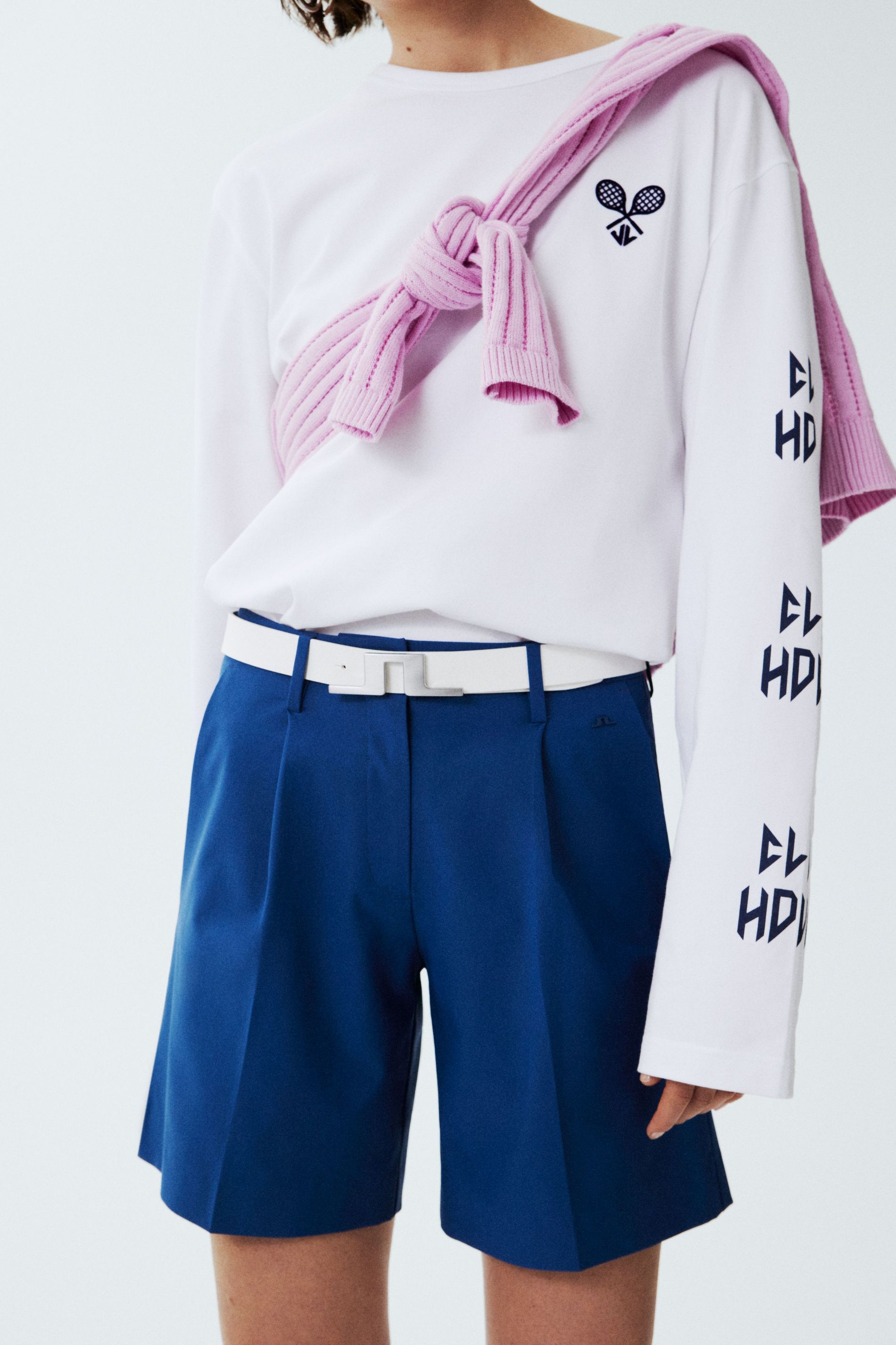 A white crew neck top and navy shorts from J.Lindeberg's Tennis 2024 collection
