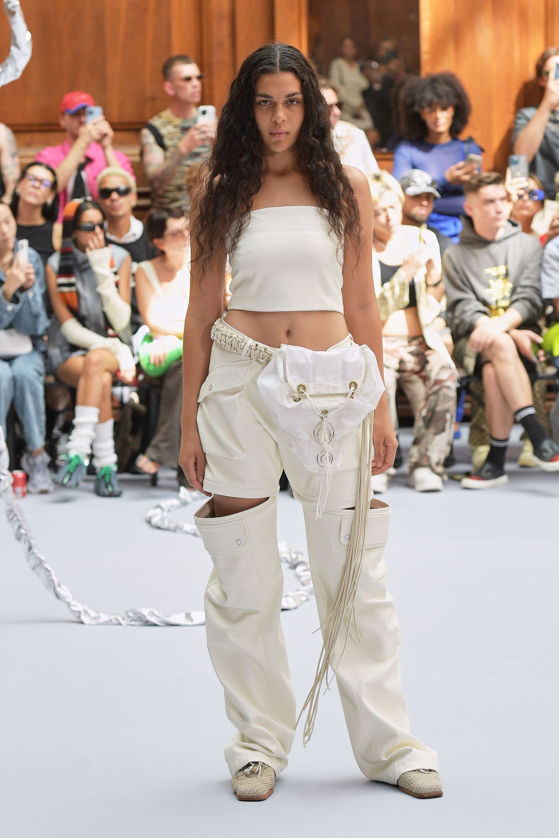 Model wears belt bag at Holzweiler's SS23 show