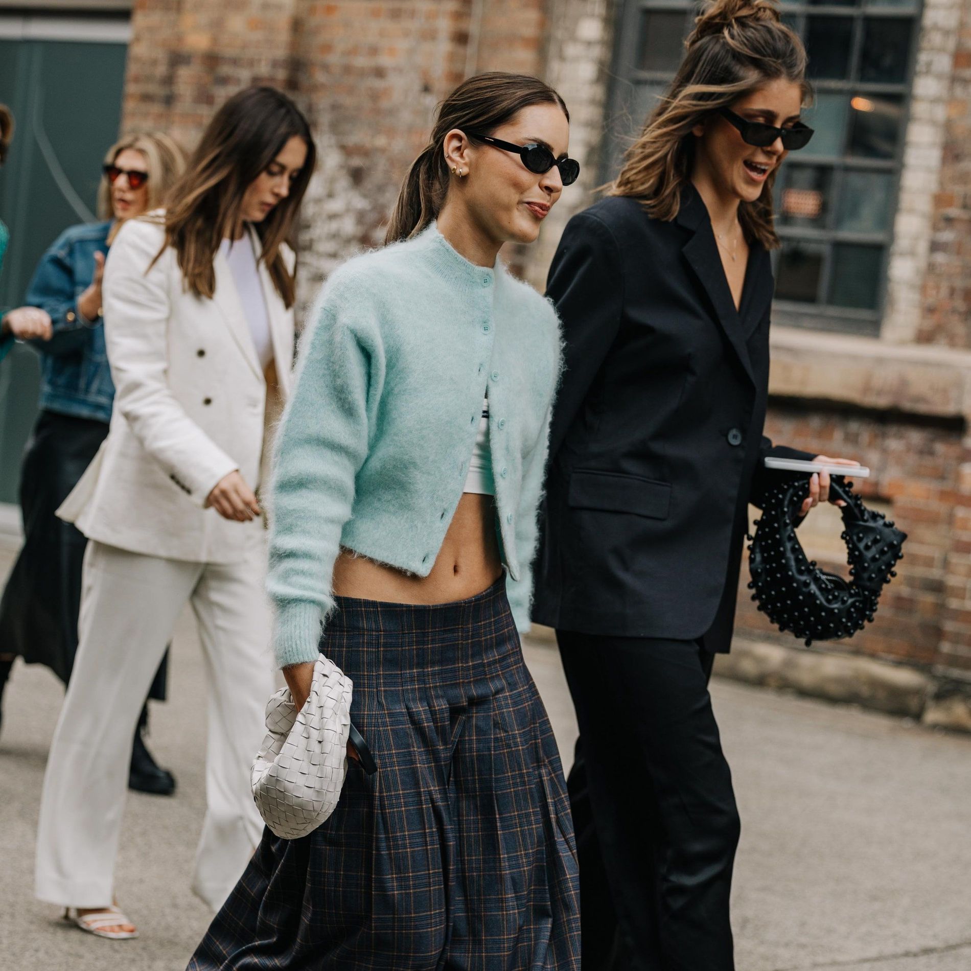 A cropped knit and low waist is the combo of choice for street