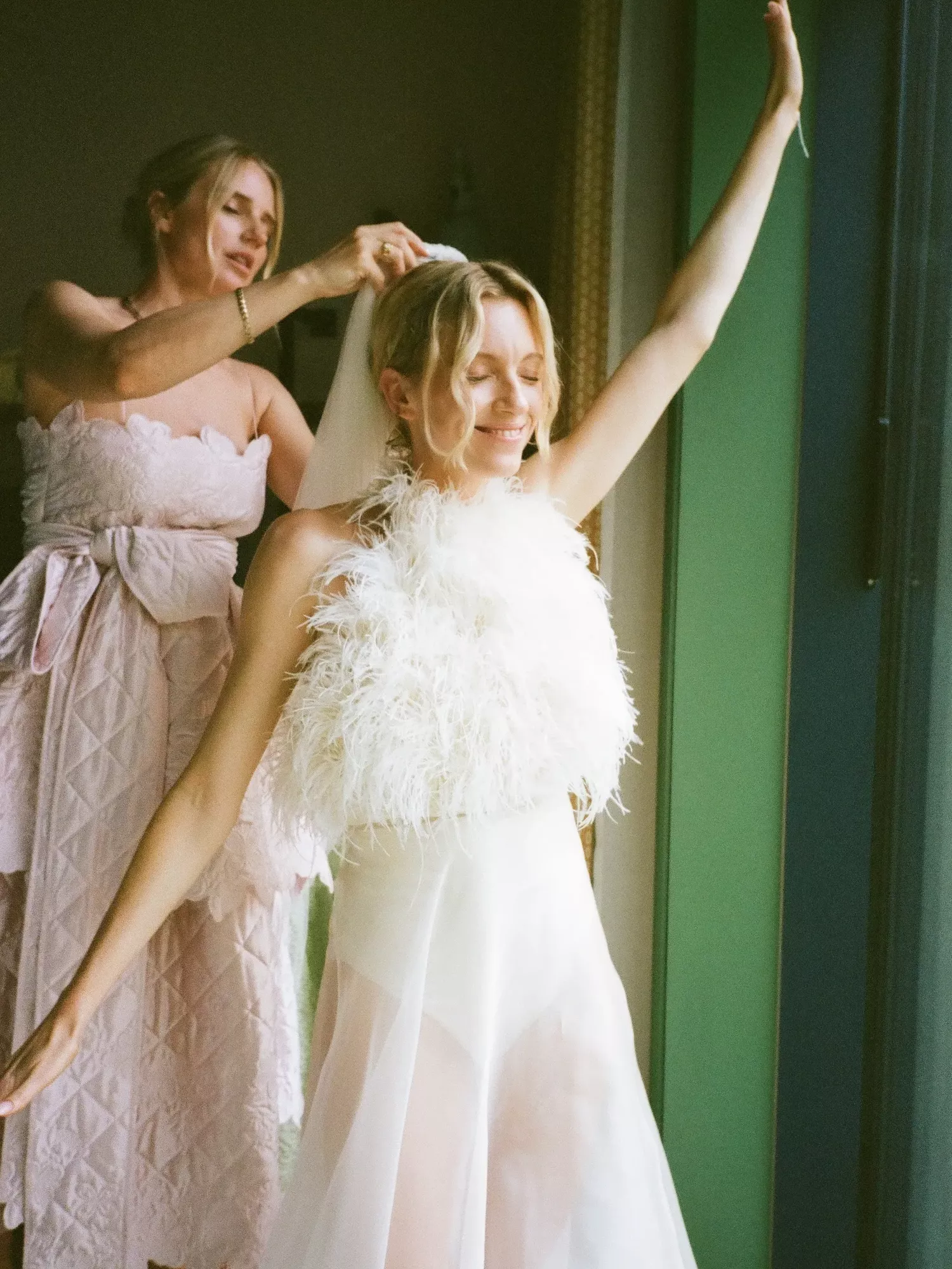 This Copenhagen bride spent 50 hours hand-sewing feathers onto her