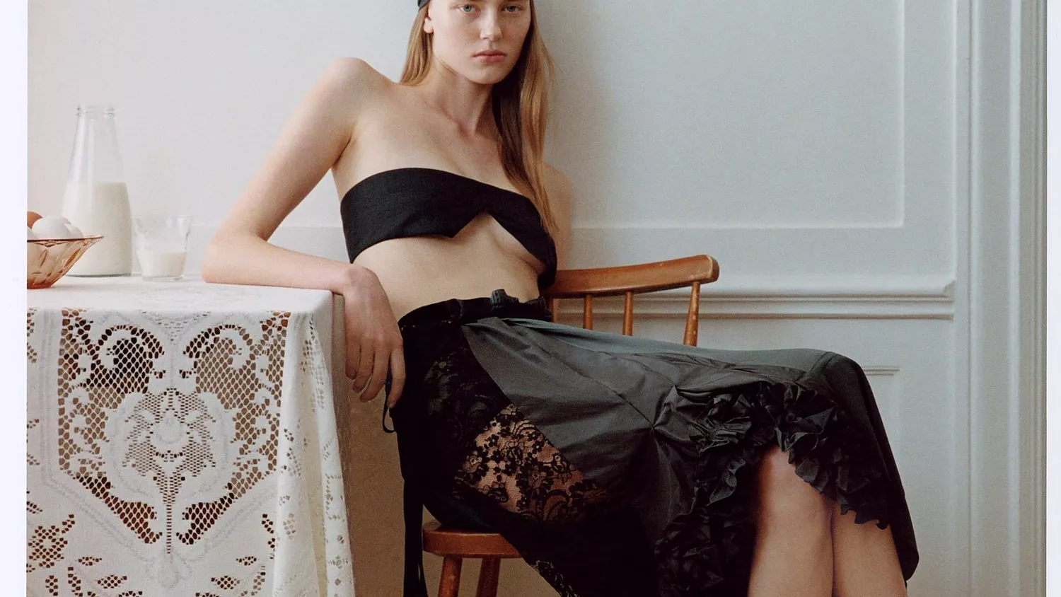 Model poses in lace midi skirt 