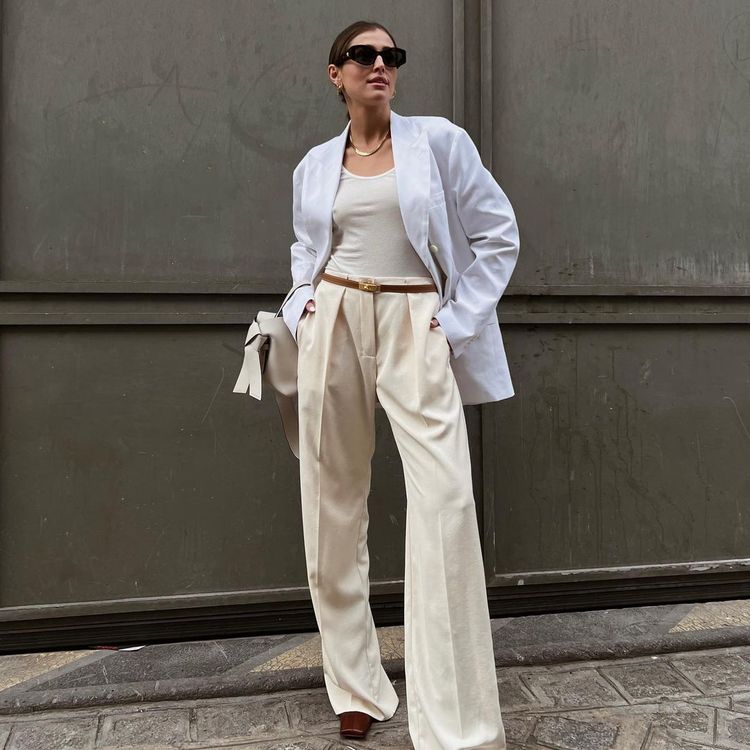 white bra top with white blazer and jeans