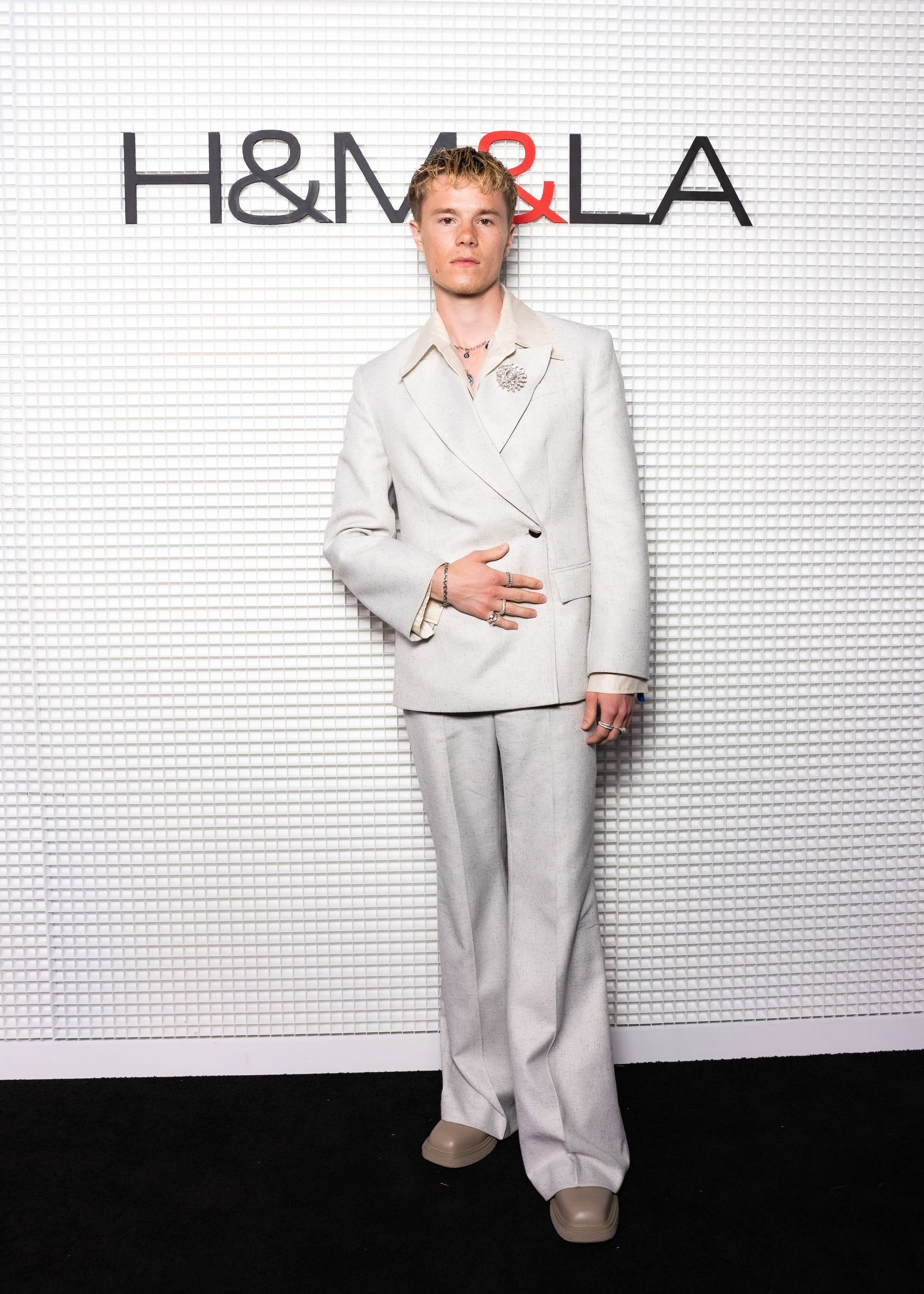 Edvin Ryding in grey suit at H&M&LA event 