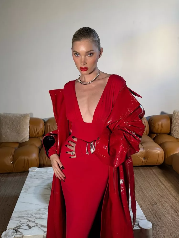 Elsa Hosk wears an all-red outfit, slicked back hair and red lipstick