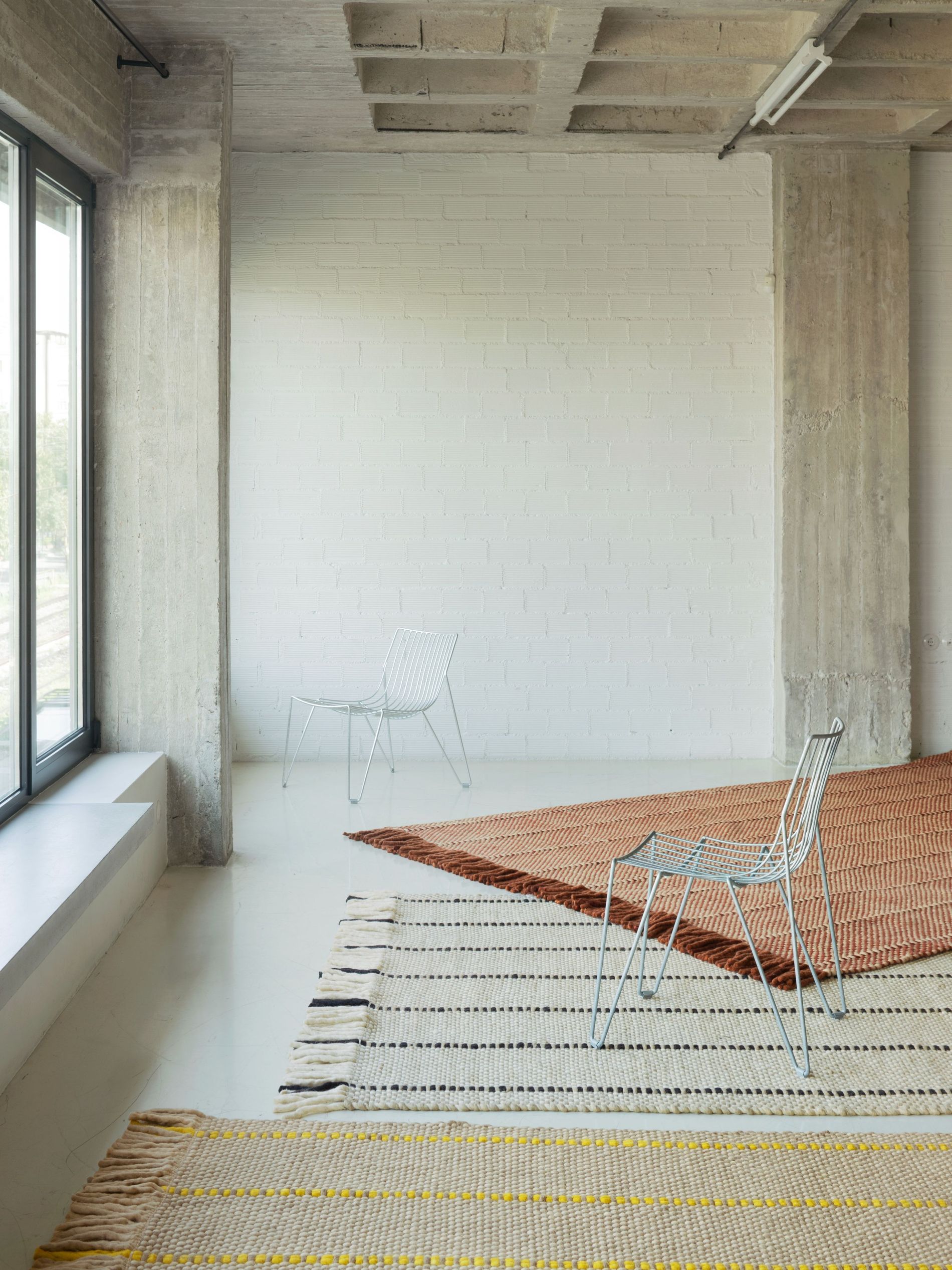 Layered x Massproductions rug collection pictured in a room