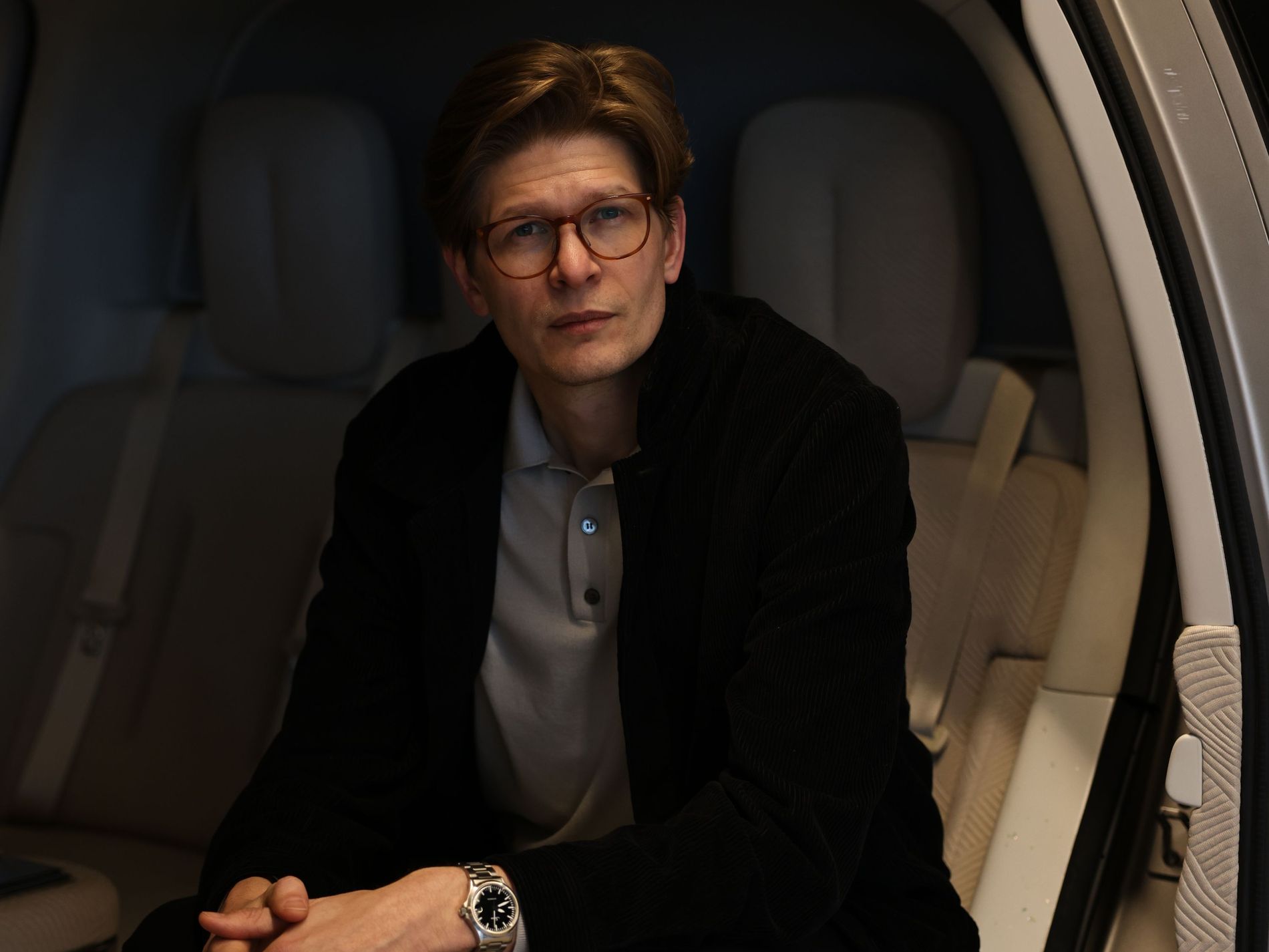 Jon Rådbrink, Head of Exterior Design at Zeekr, sitting in a Zeekr car