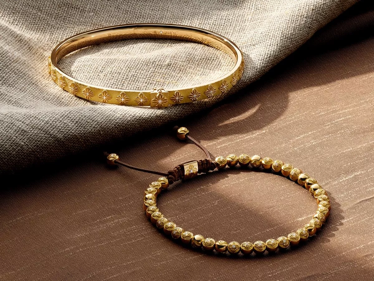 Two Bracelet from Shamballa Jewels displayed on linen fabric