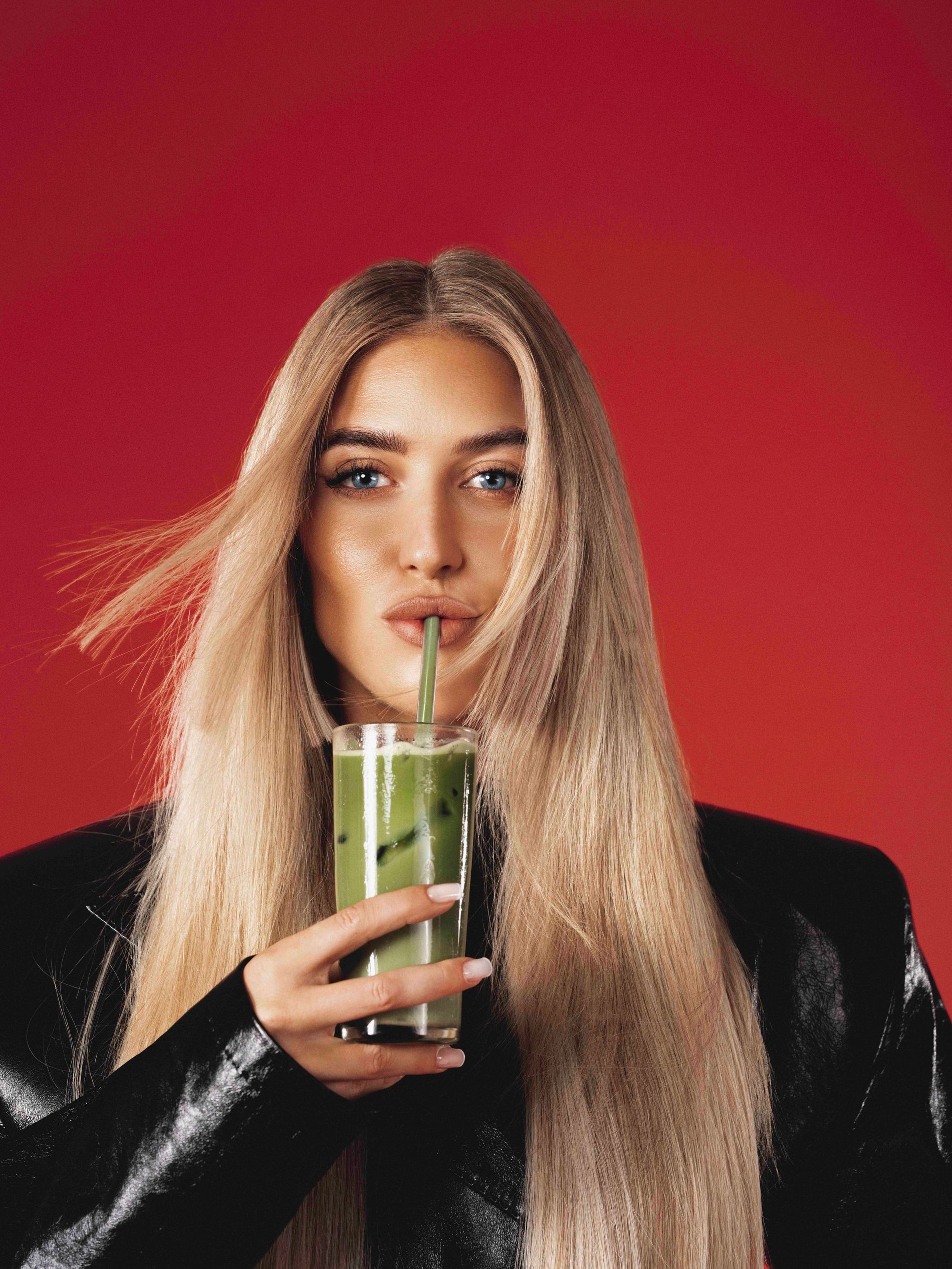 Emili Sindlev drinkin a glass of matcha