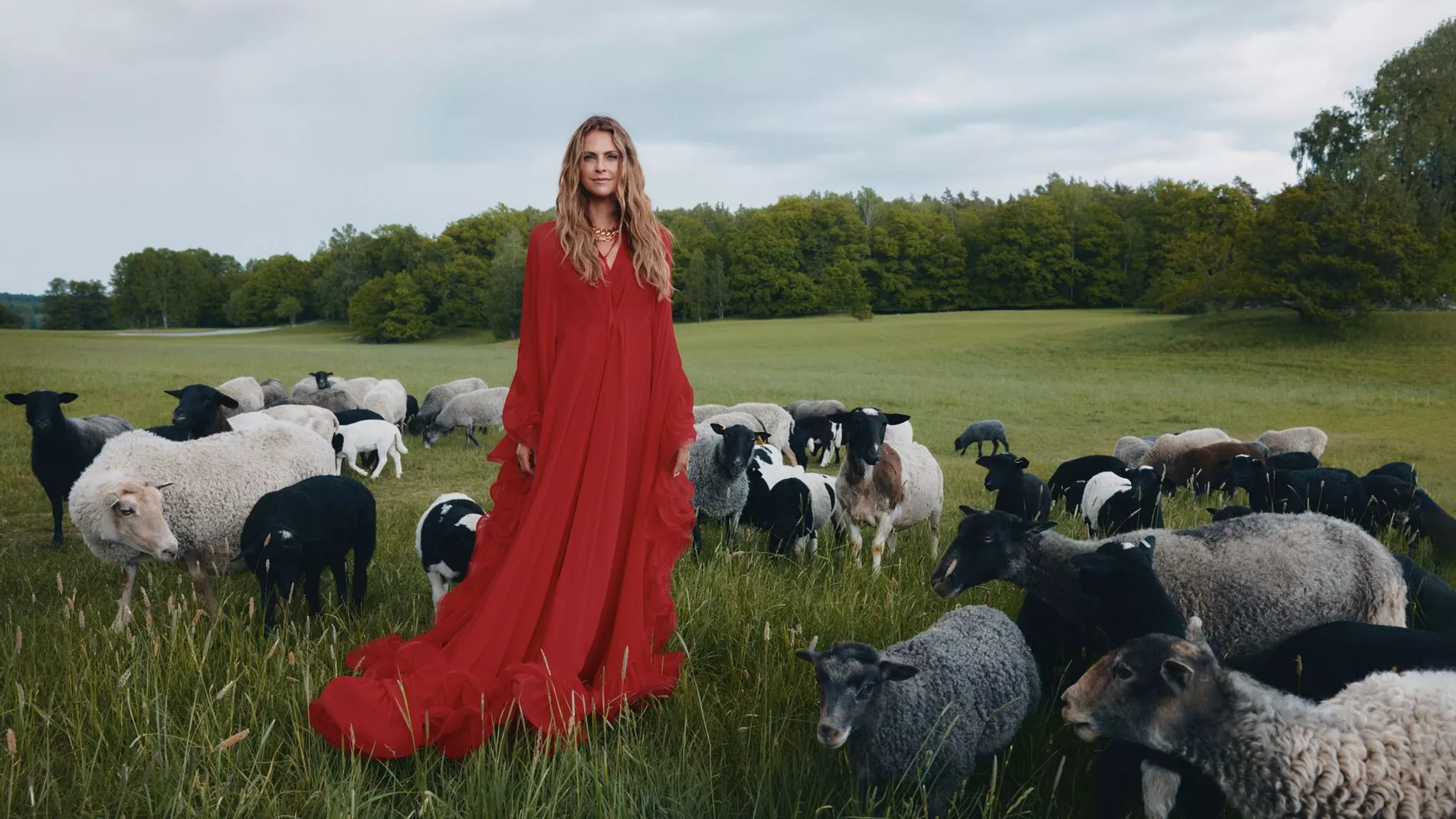Princess Madeleine wearing a red silk chiffon dress