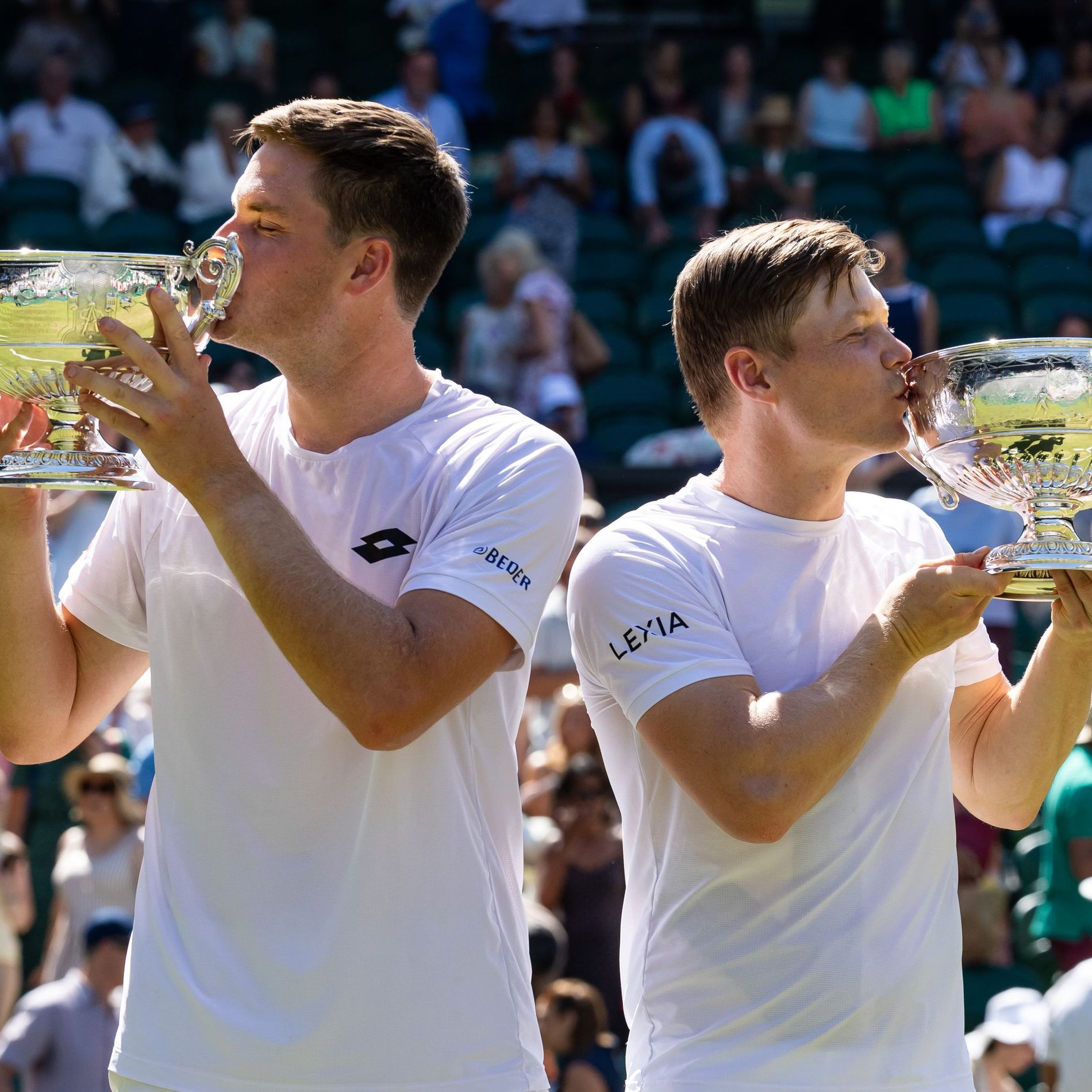 Harri Heliovaara of Finland and Henry Patten of United Kingdom pose with their Gentlemen's Doubles final trophy after their victory at Wimbledon 2026