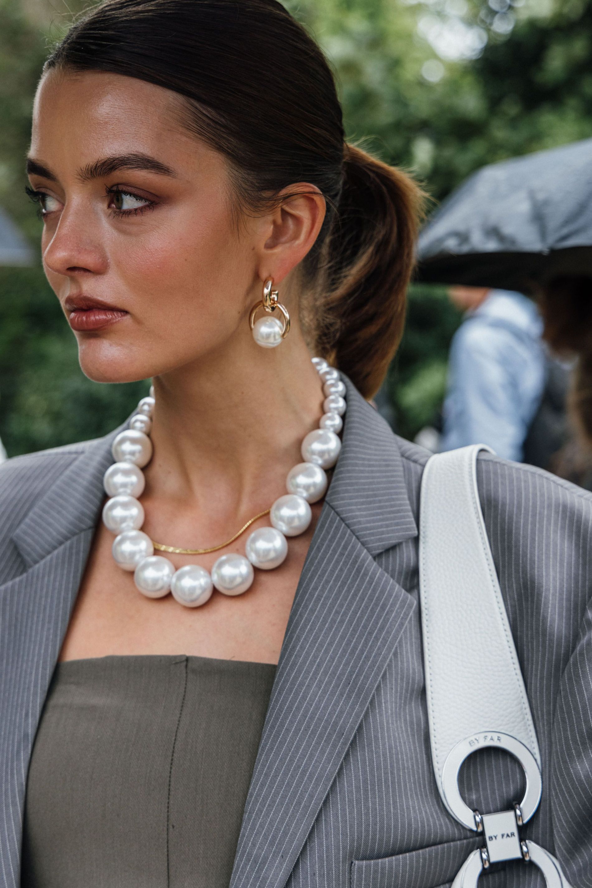 Guest wears a pair of pearl statement earrings to Copenhagen Fashion Week SS24
