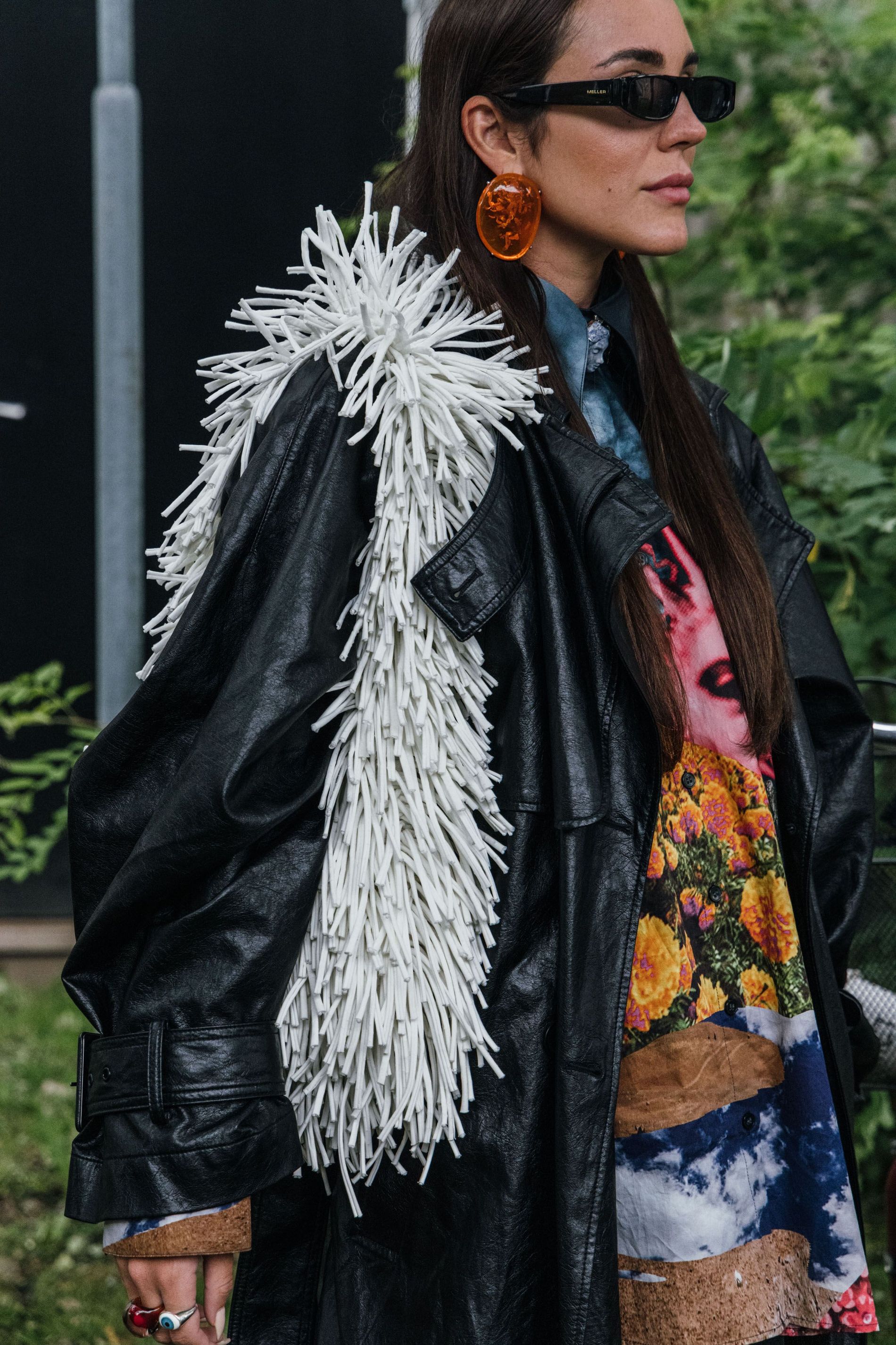 Guest wears a pair of resin statement earrings to Copenhagen Fashion Week SS24