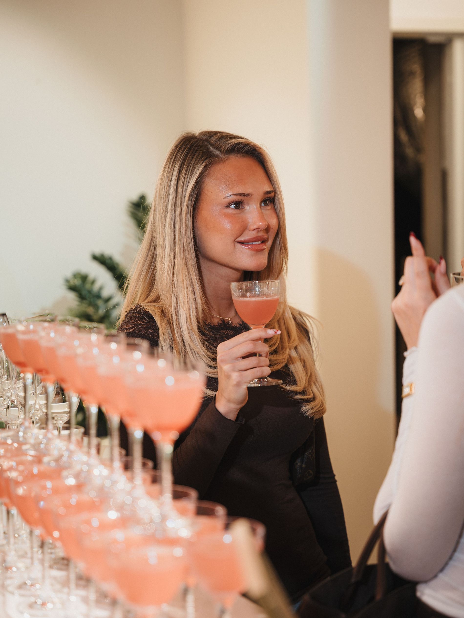Céline Carlsson on the intimissimi X Vogue Scandinavia event holding a drink