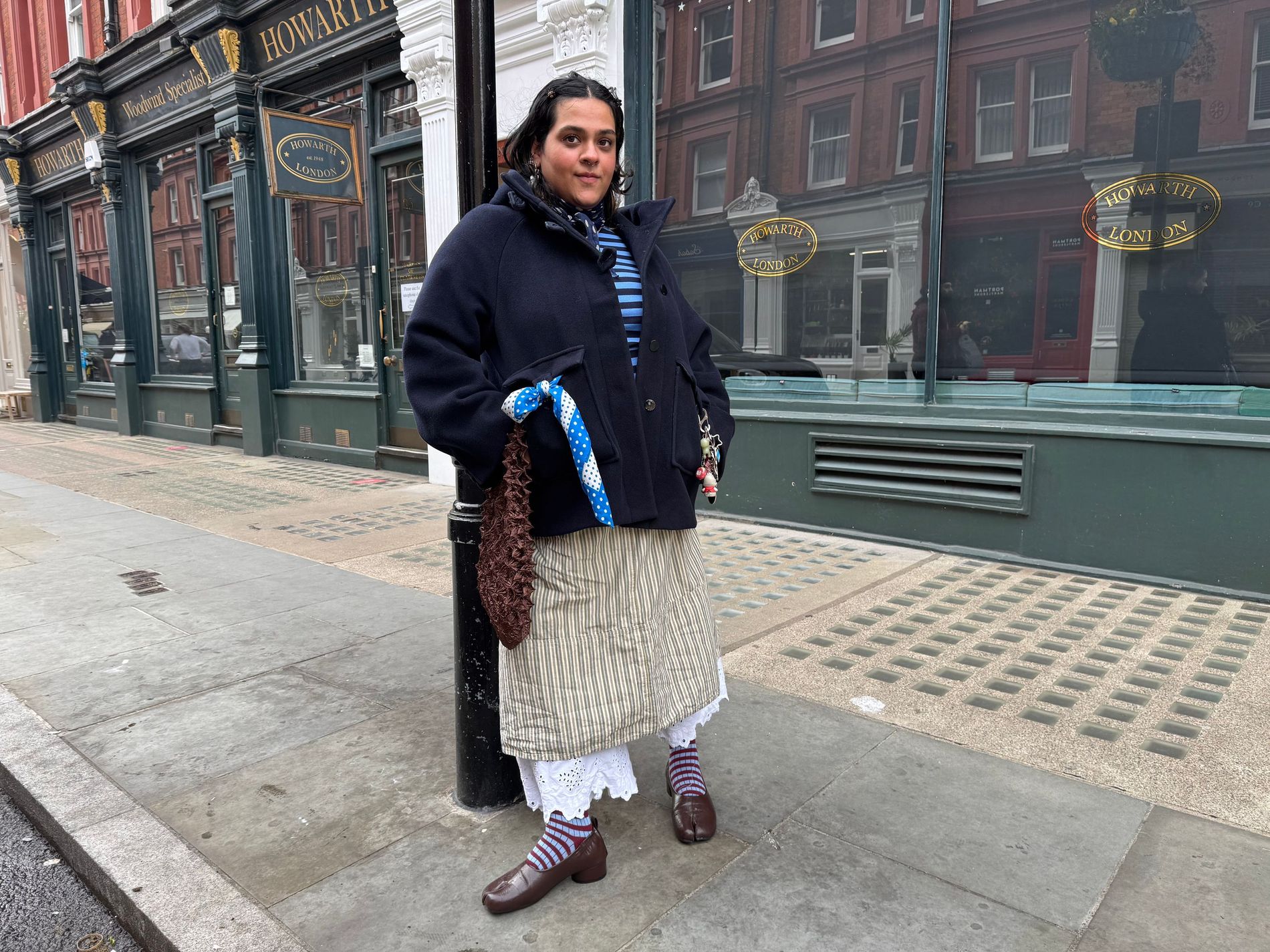 A woman standing on the streets of London