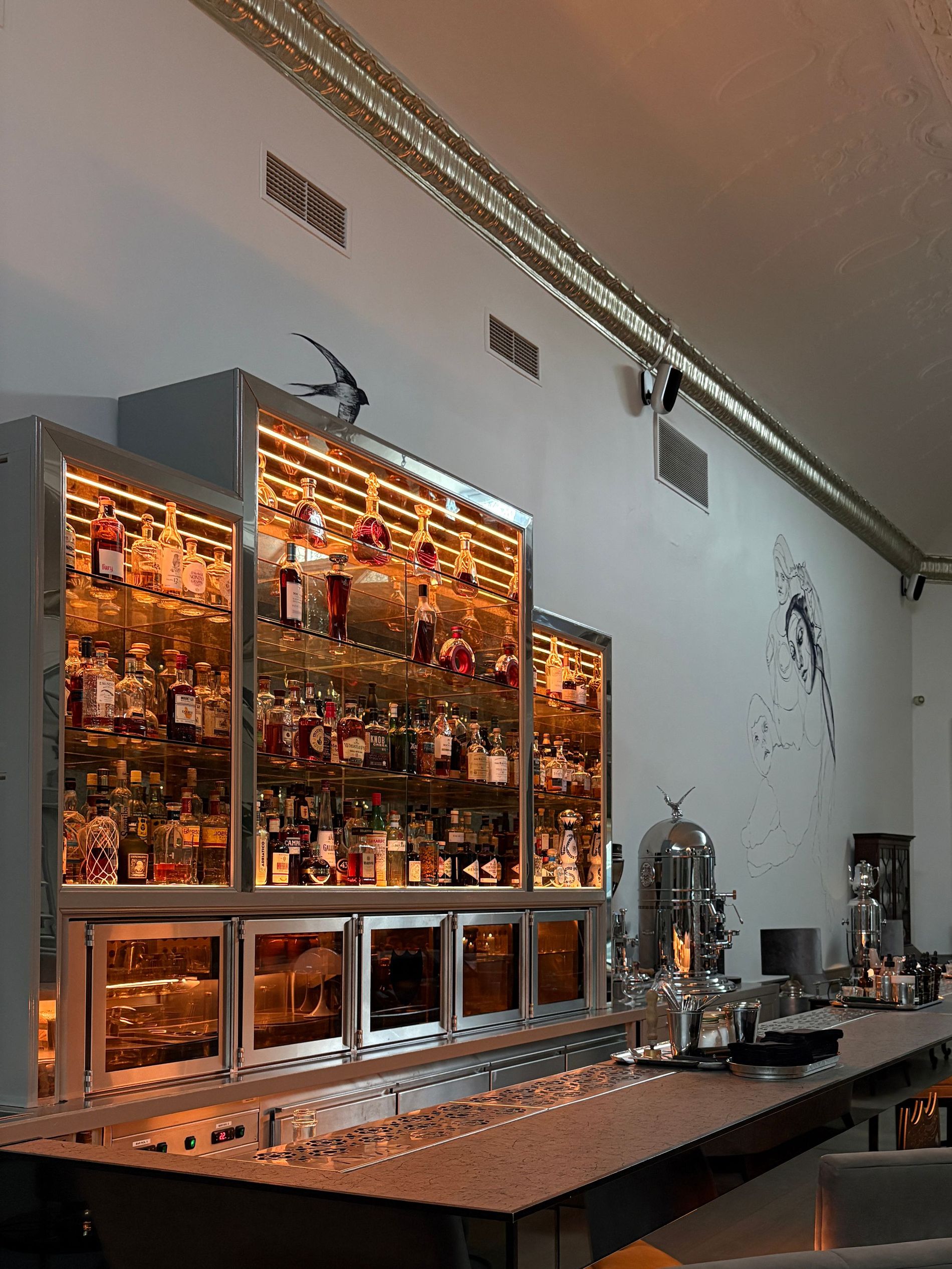 The interior of Nimb Bar in Copenhagen, including bar counter, seating area, exterior