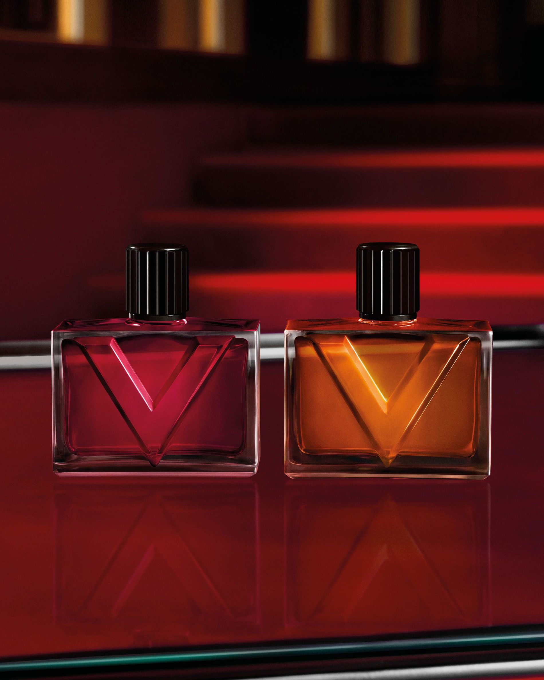 The Vendetta Uomo and Donna perfumes, lined up on a glass table