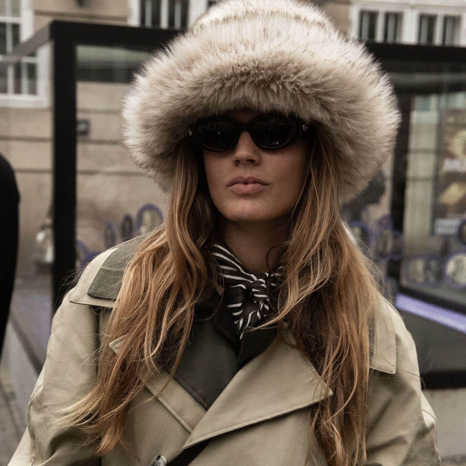 A guest wears a faux fur hat at Copenhagen Fashion Week