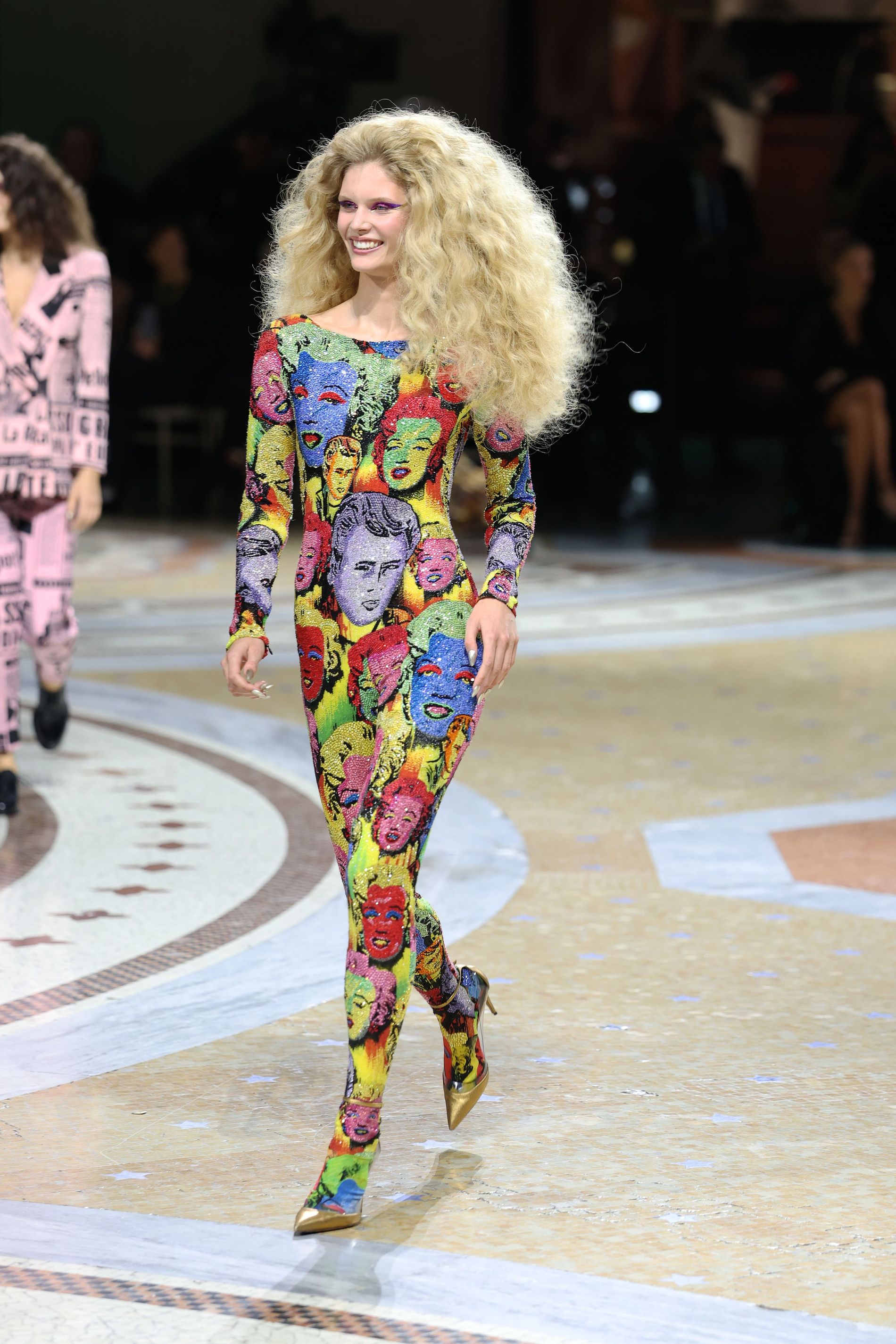 Ida Heiner in Milan fashion week wearing Andy Warhol-inspired pop art bodysuit with a Marilyn Monroe and James Dean print from Versace's Spring 2018 tribute collection