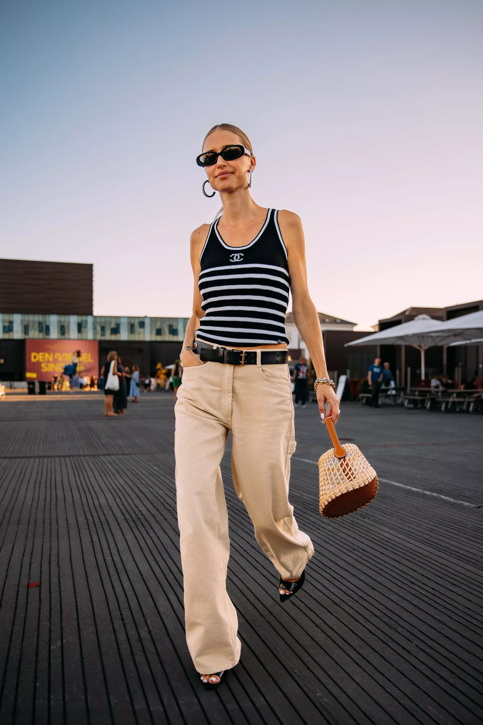Copenhagen Fashion Week guest pairs striped chanel tank with beige jeans 