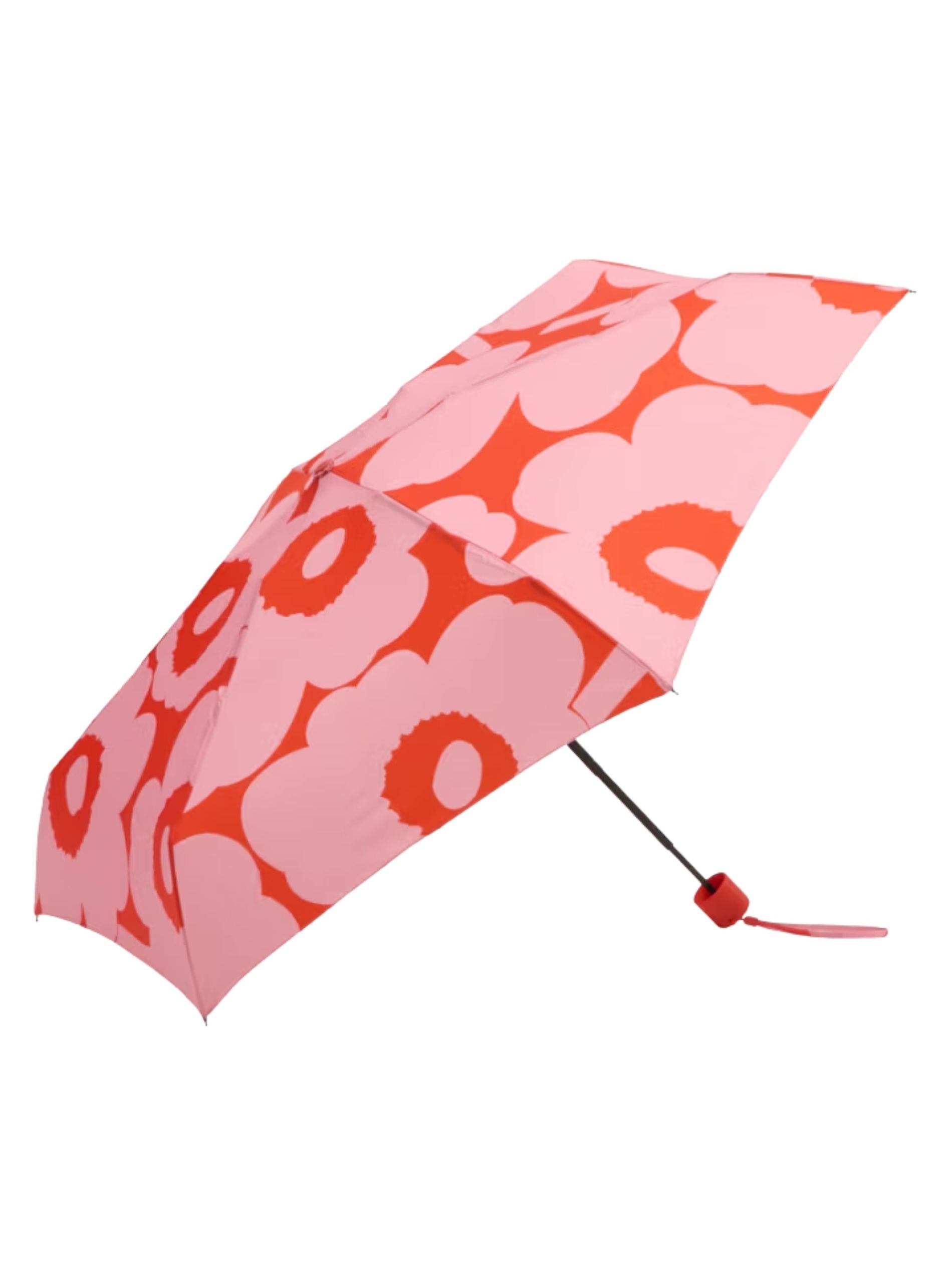 Red and white floral umbrella against a white background