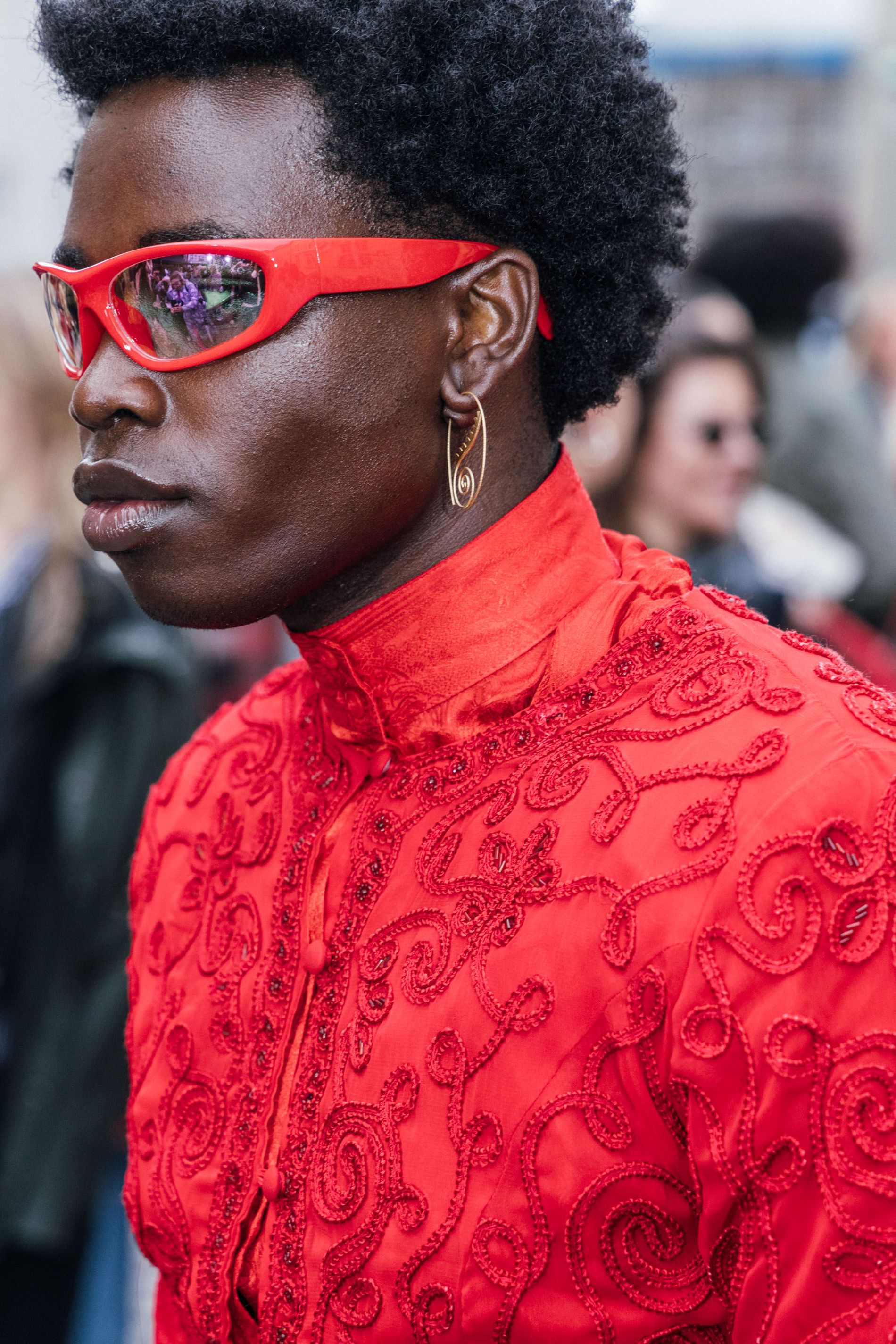 Guest wears a pair of gold statement earrings to Copenhagen Fashion Week SS24