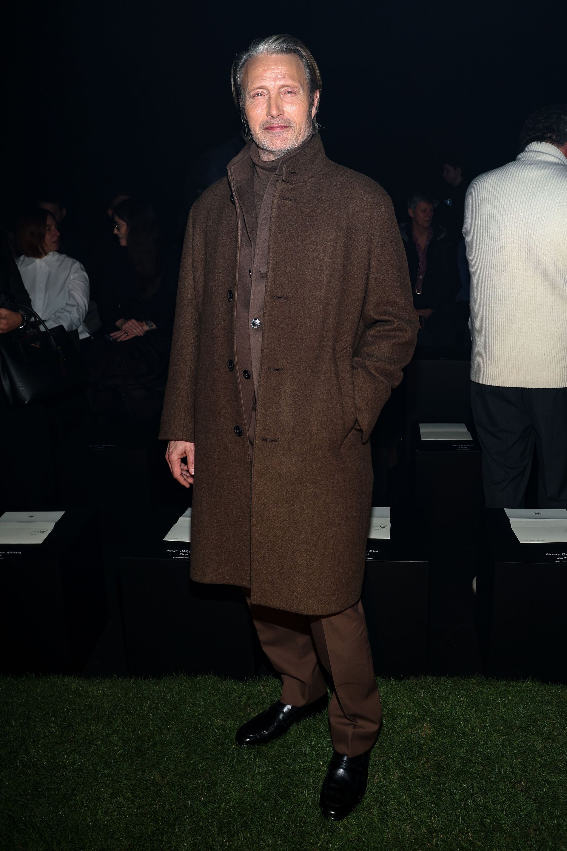 Mads Mikkelsen wearing a brown outfit at the Zegna fashion show 