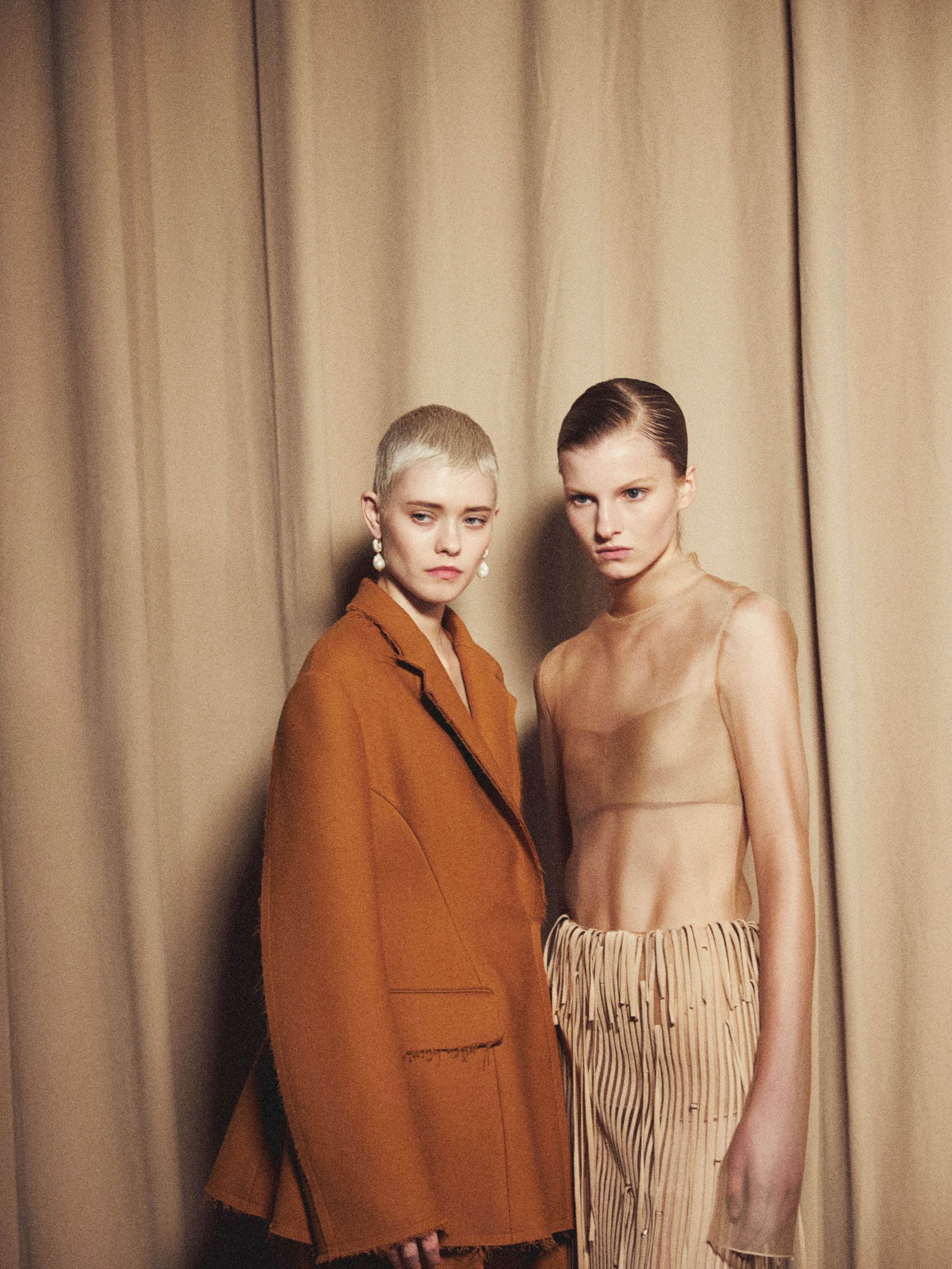 Models pose backstage at Jason Wu's AW23 show wearing Pearl Octopuss.y earrings