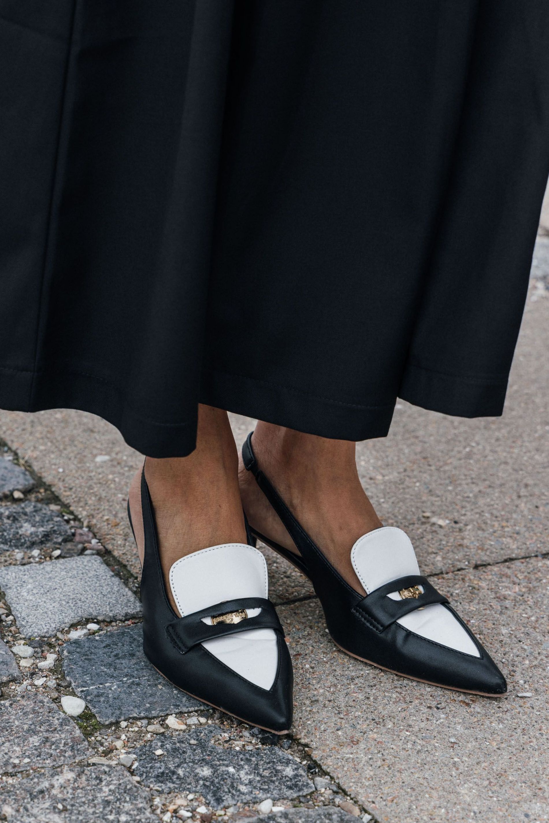 Guest attending CPHFW SS24 wears the sling-back loafer trend