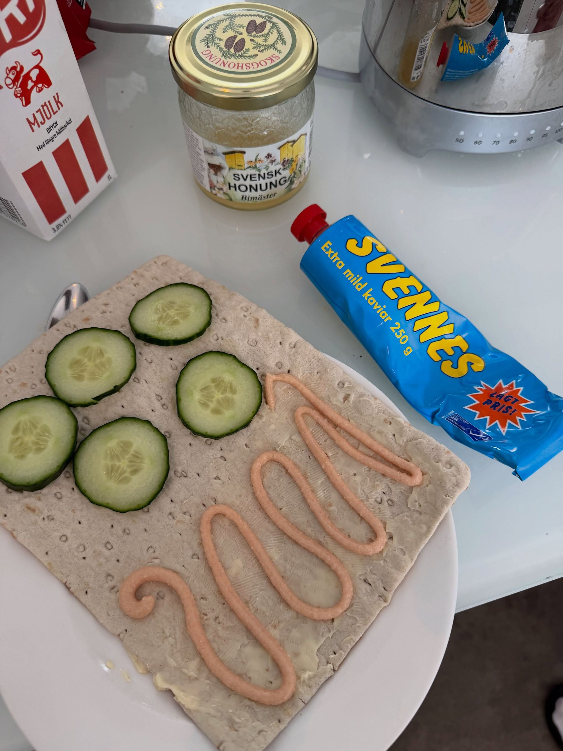 Maya Jama eats Svennes extra mild caviar with cucumber. Also in the picture mjolk and svensk honung