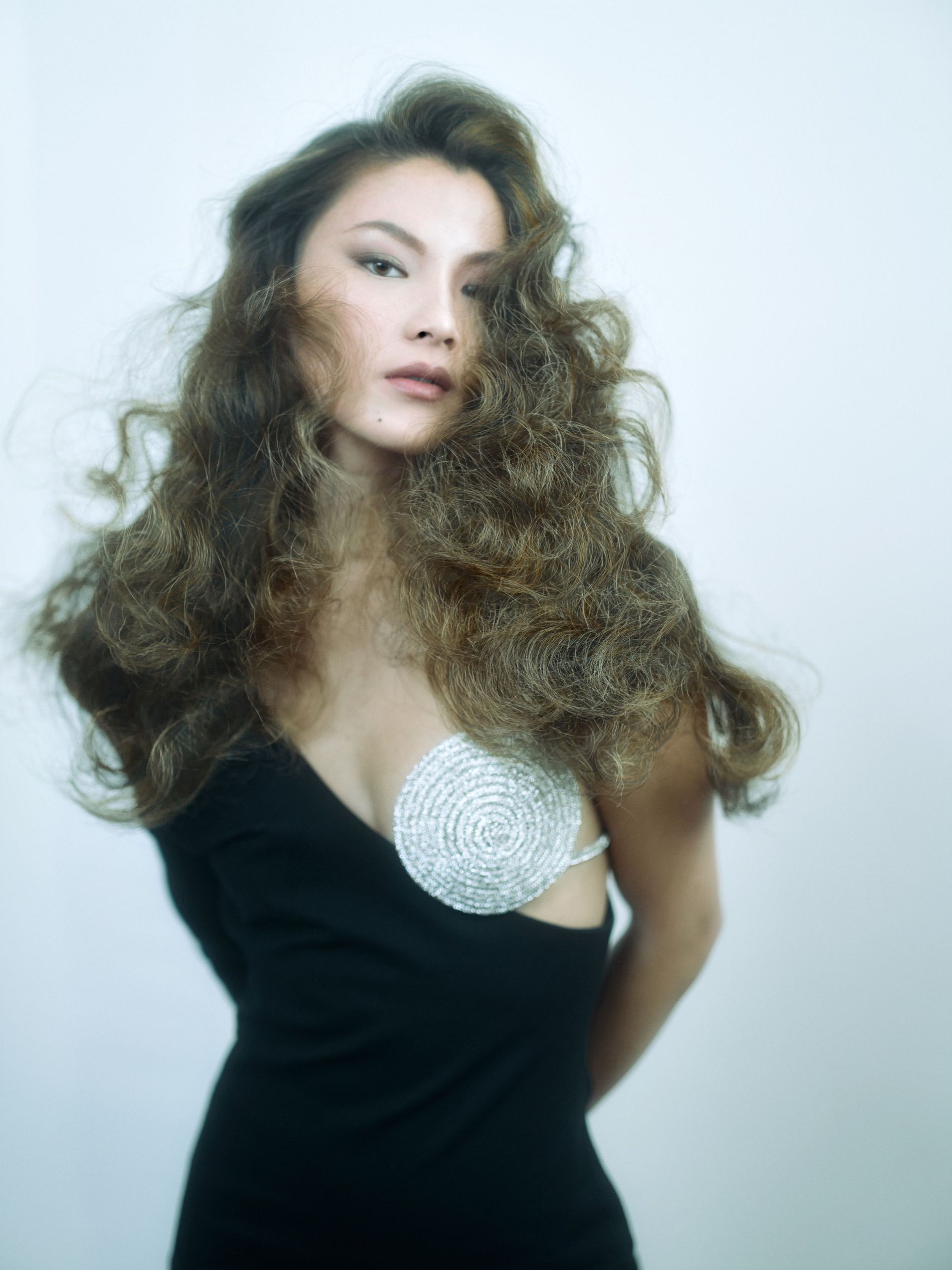 Model poses with high, yet brushed out 'Swedish Grace' waves in her hair
