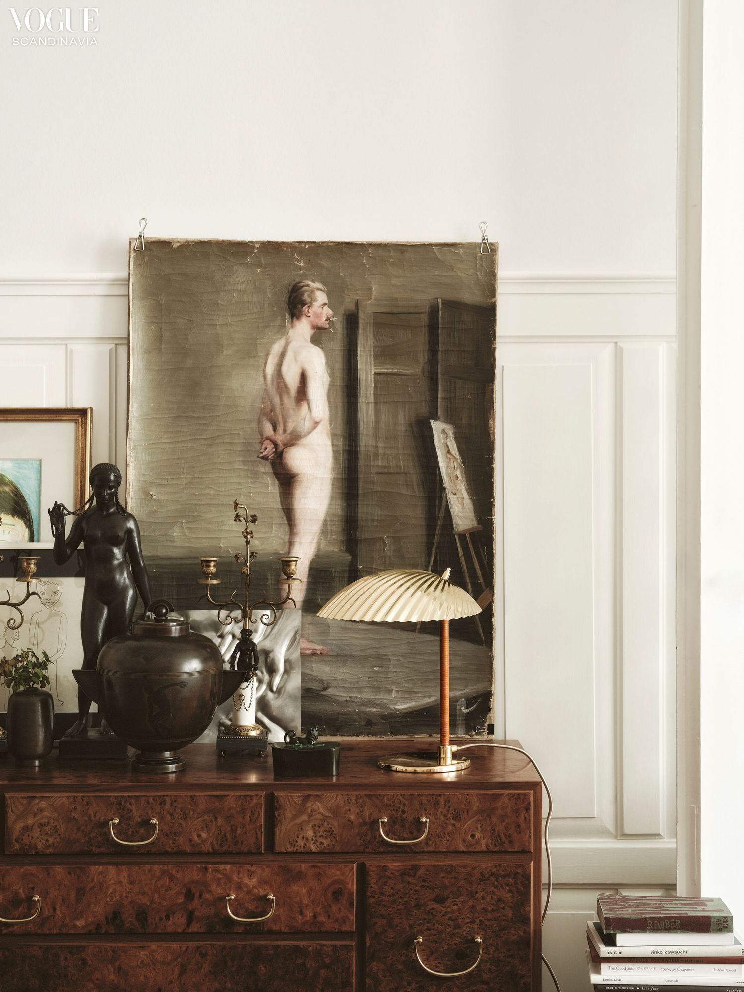 A table lamp on a wooden cupboard