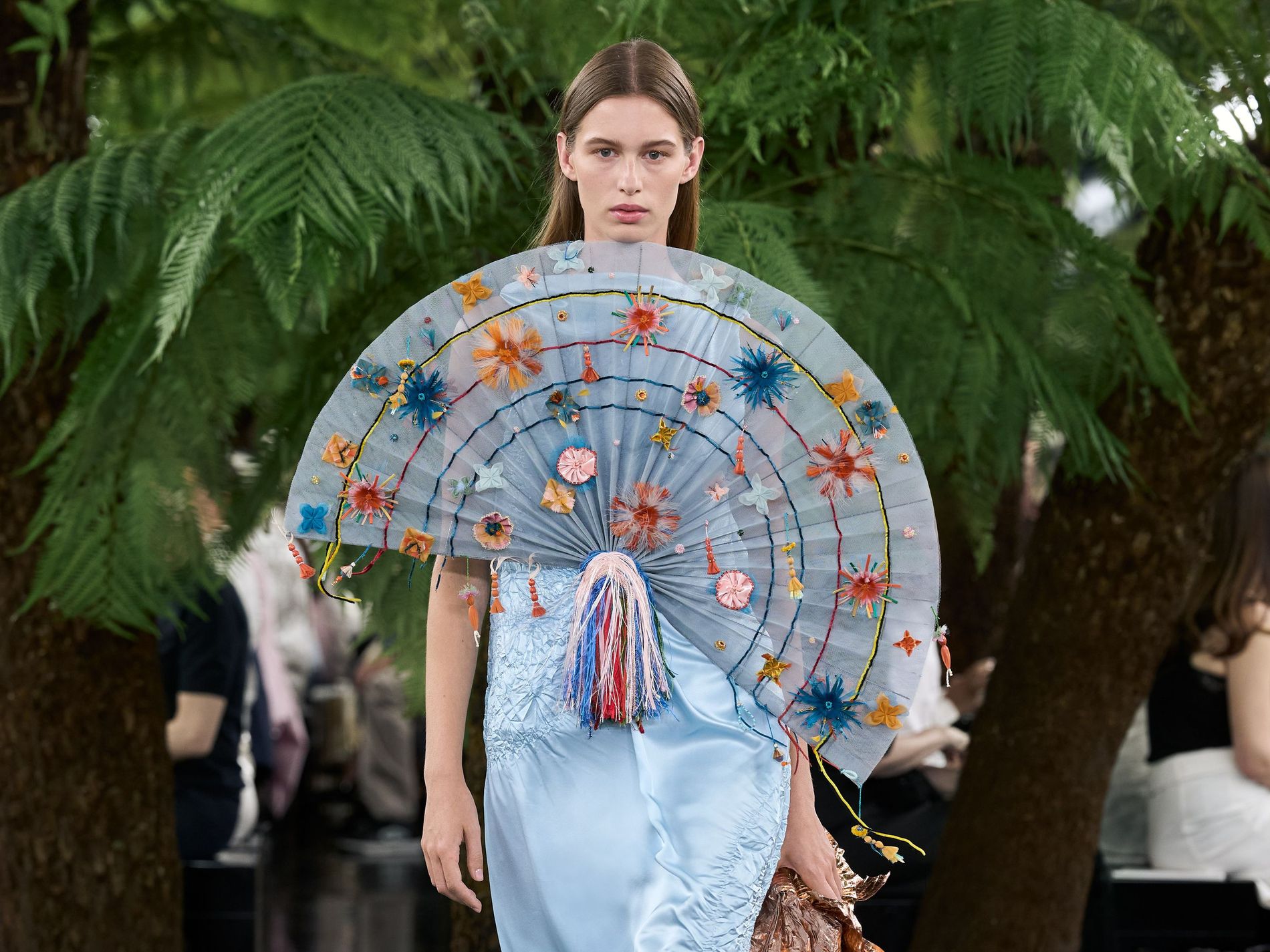 Model wearing a big fan-adorned pale blue dress on Dior's Haute Couture Fawll/winter 2026 runway
